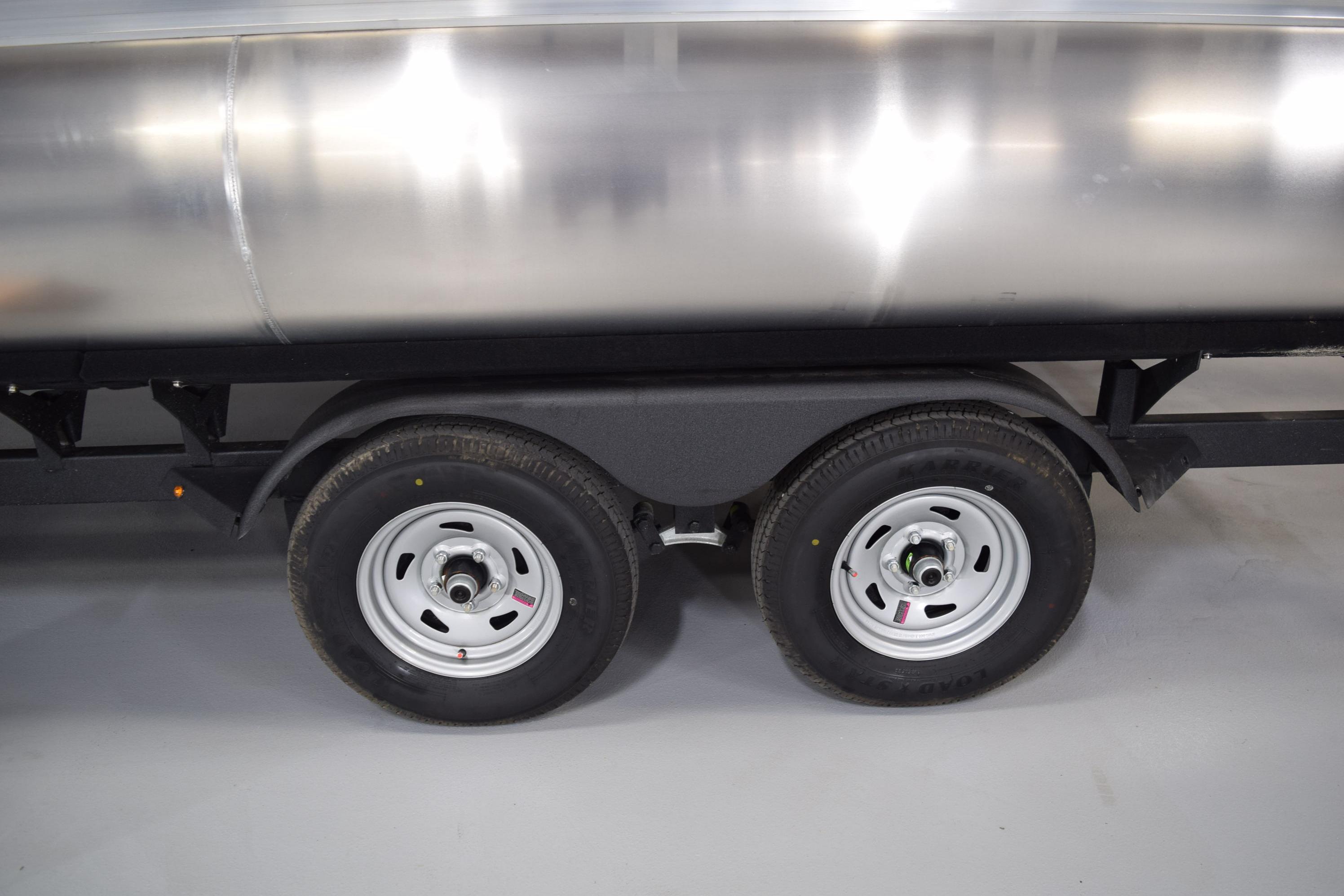 Trailer wheels of 2026 Sun Tracker Party Barge 20 DLX pontoon boat.