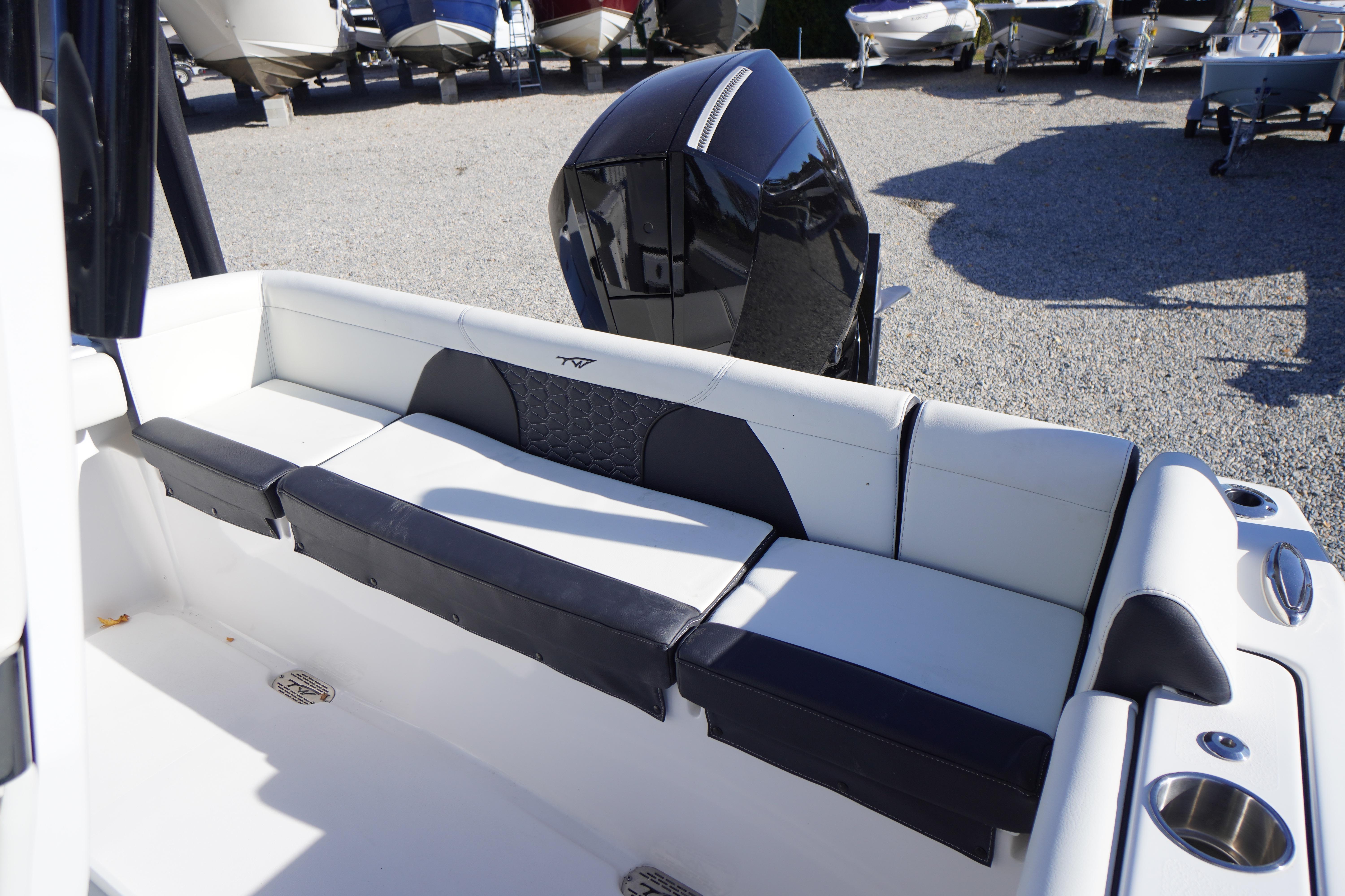 2024 Tidewater 232 SS boat interior with cushioned seating and sleek design.