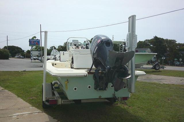 2017 Jones Brothers Bateau 17 boat with outboard motor on trailer.