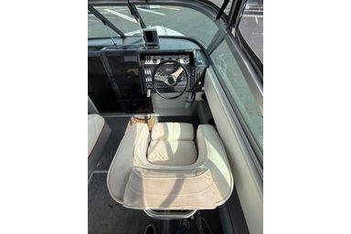 Interior of 1989 Cobalt Condurre 243 boat with steering wheel and seating.