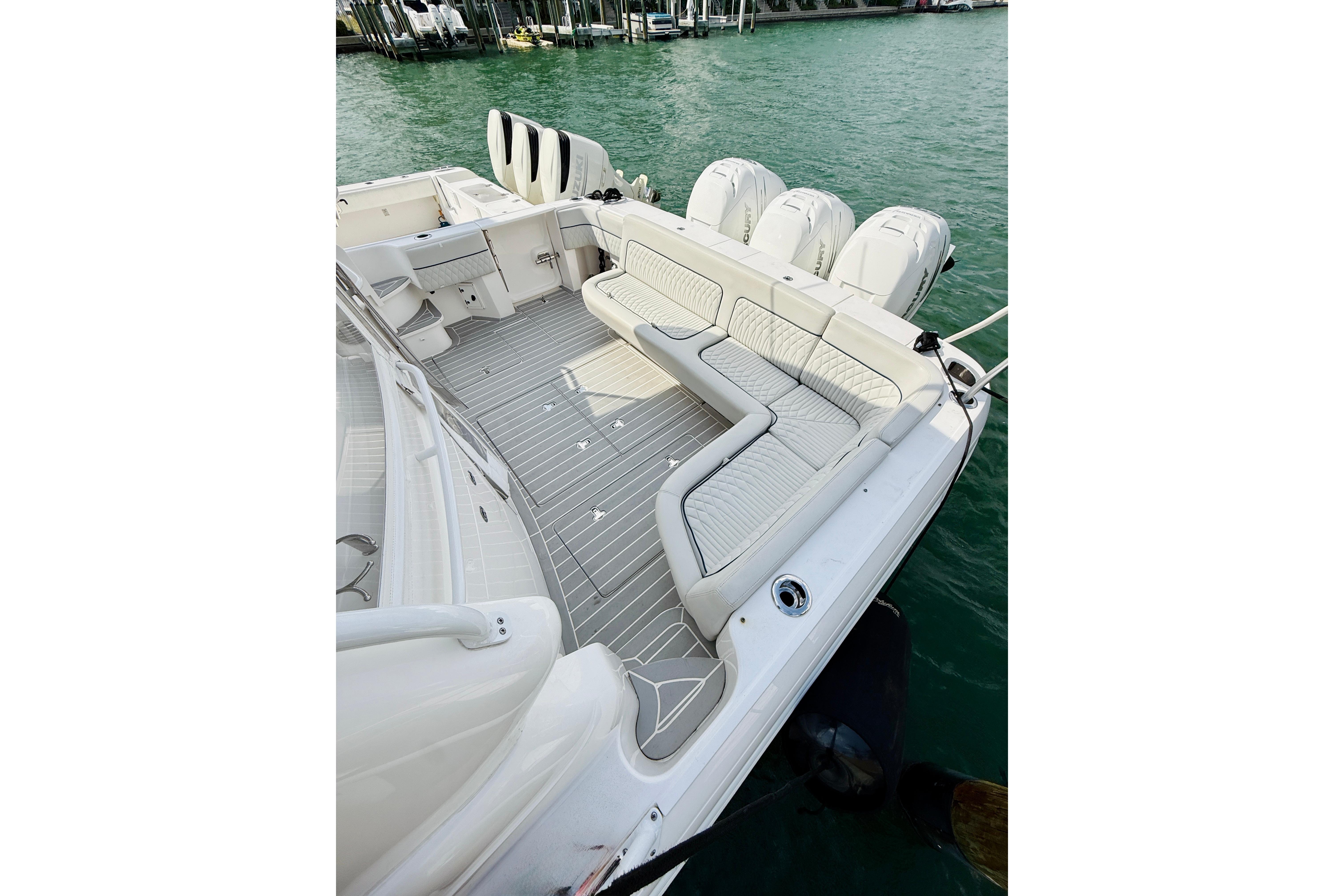 2021 Intrepid 410 Evolution boat with spacious seating and triple outboard engines.