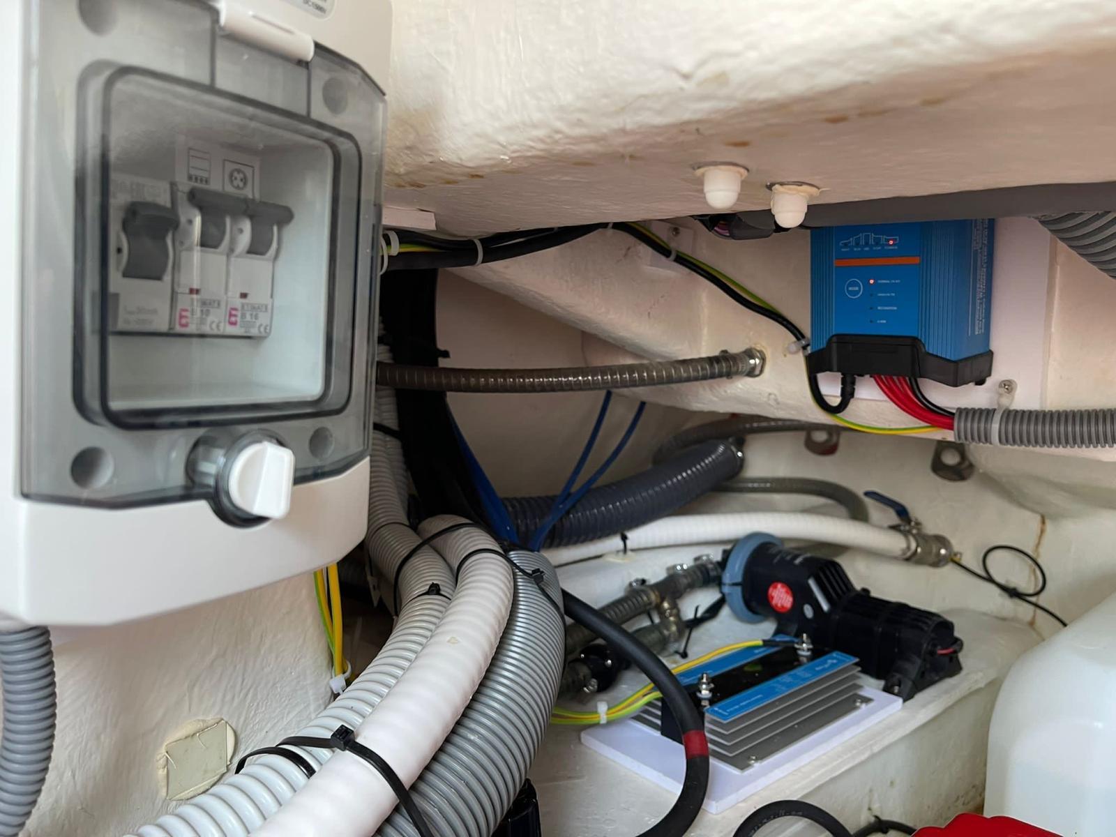Electrical system components in a 2020 Zar 85 SL boat, featuring wiring and circuit breakers.