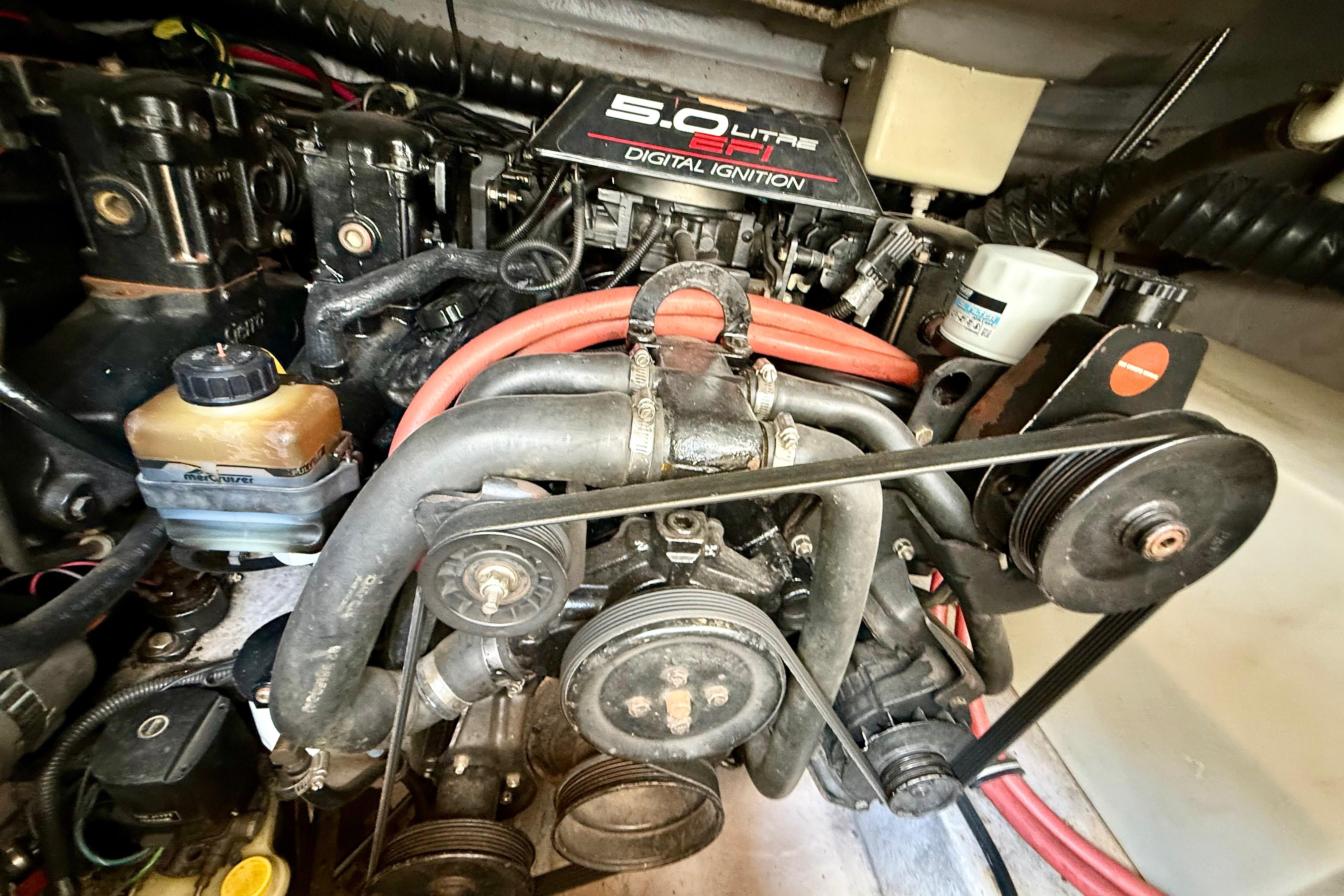 Engine compartment of a 1999 Chaparral Signature 300 with 5.0L EFI digital ignition system.