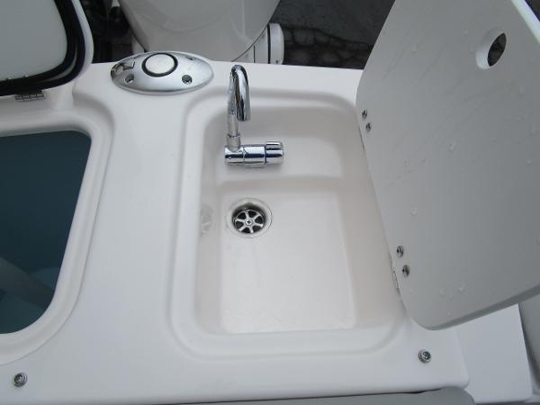 Compact sink with chrome faucet on Solara S-250 CW boat, 2025 model.