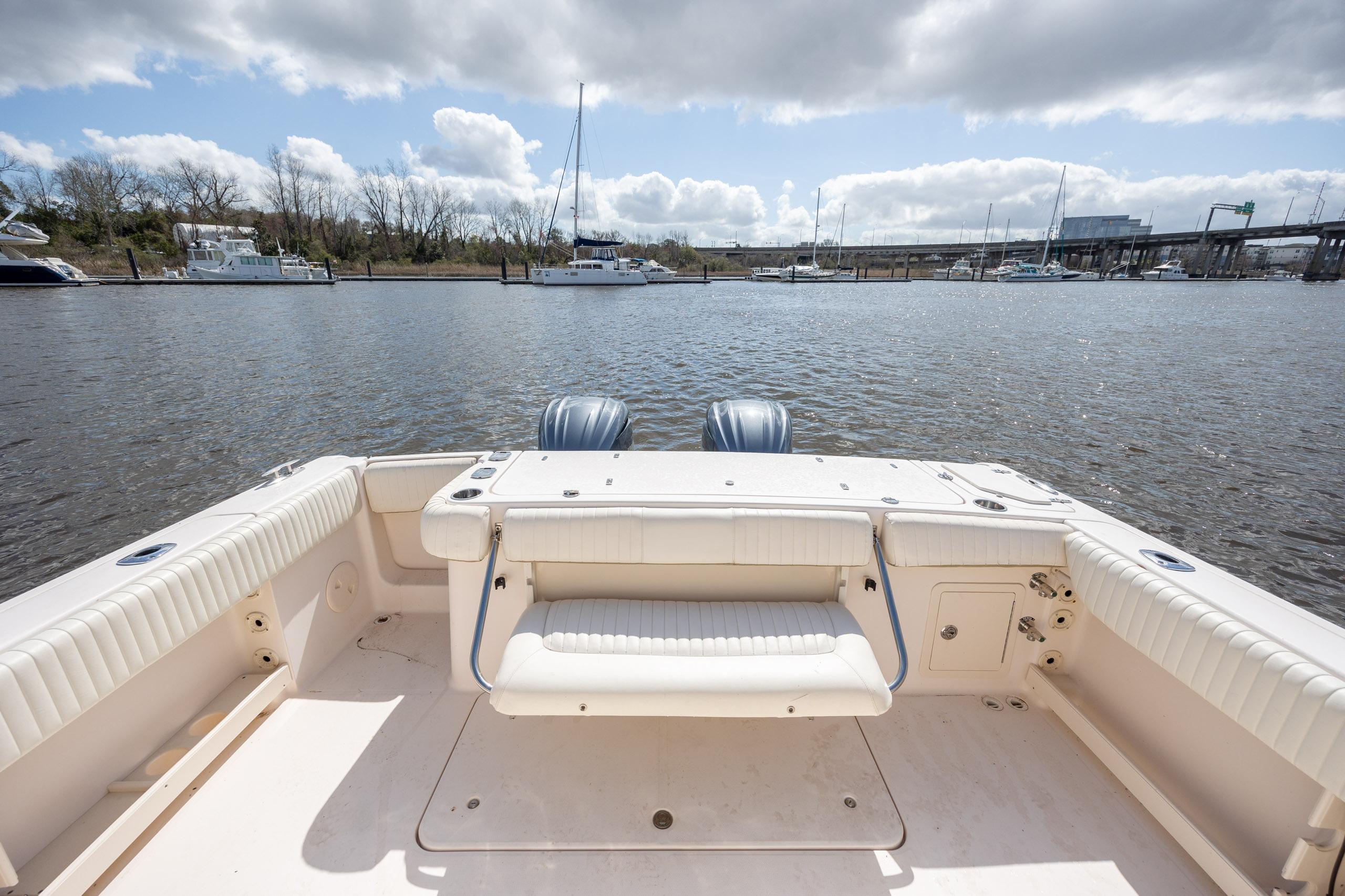 2013 Grady-White Canyon 306 boat interior with water view and docked boats.