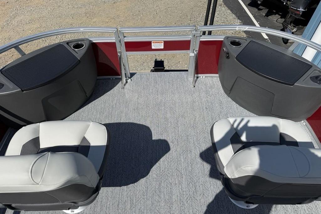 2026 Sun Tracker Bass Buggy 18 DLX pontoon boat interior with seating and storage compartments.