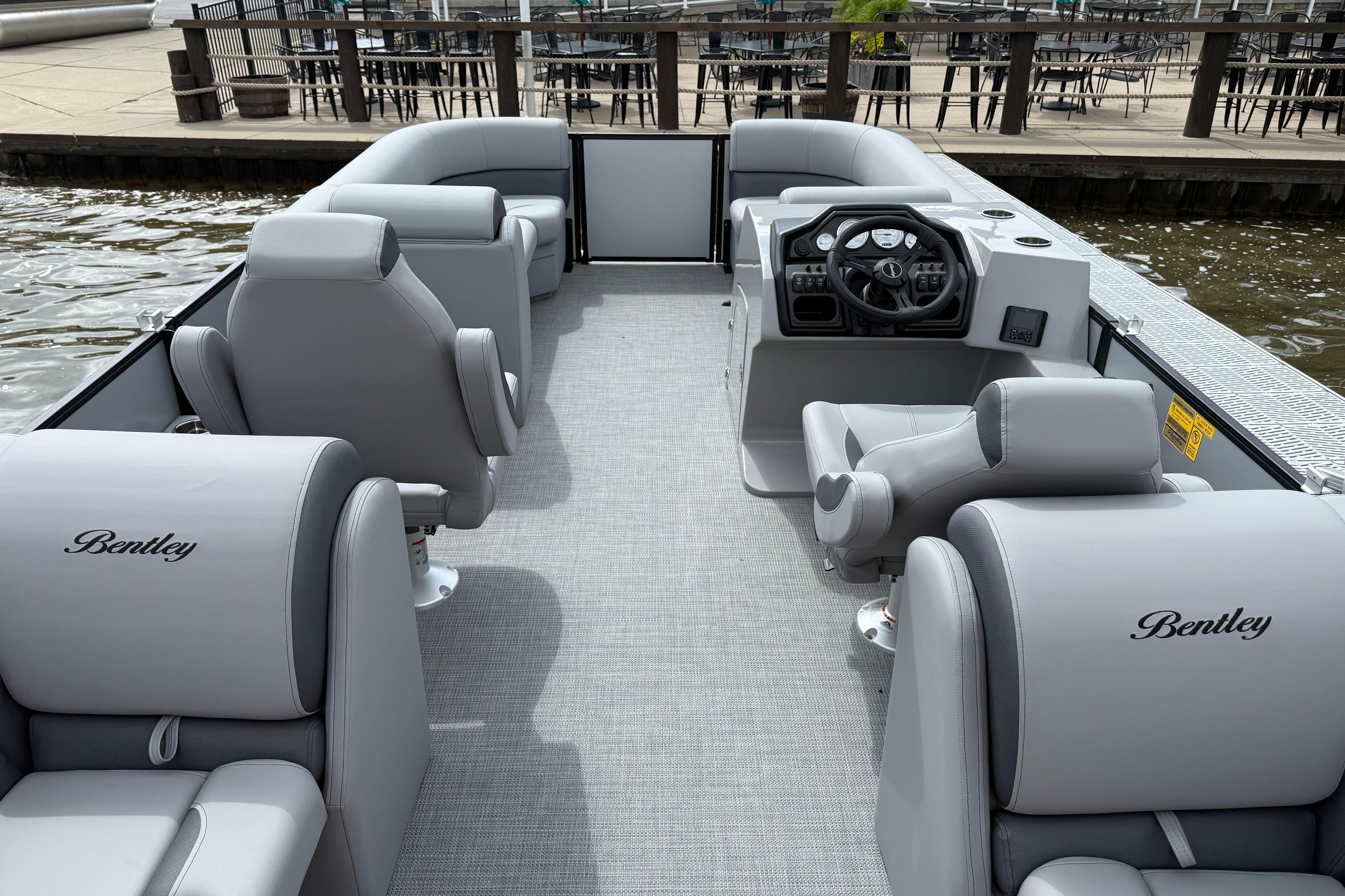 2026 Bentley Pontoons Legacy 220 Navigator with luxurious seating and modern helm.