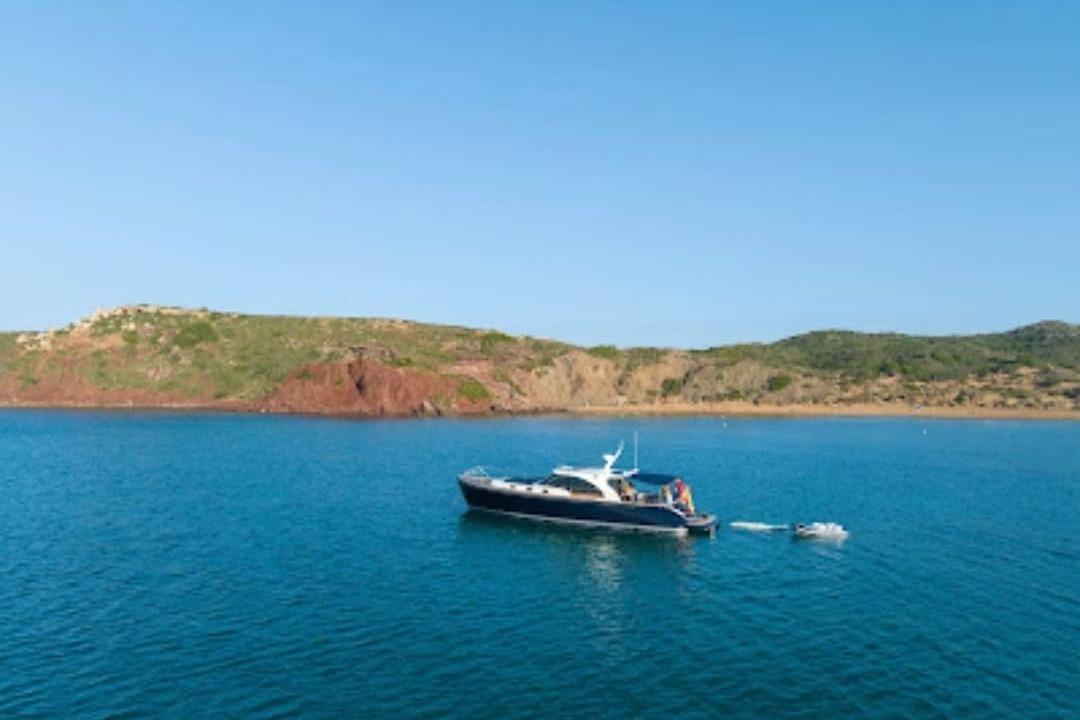 Luxury Franchini Emozione 2009 yacht anchored in serene coastal waters.