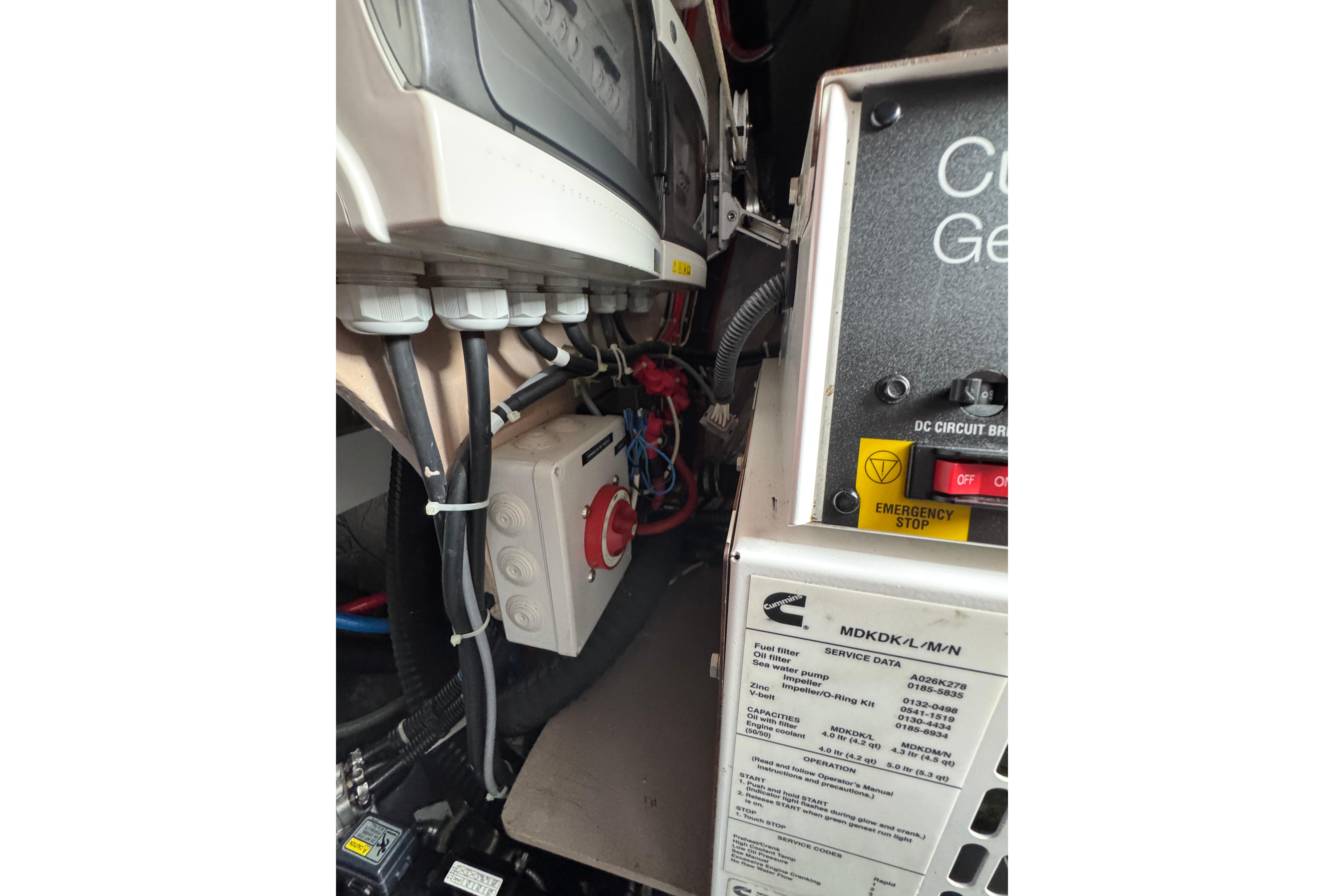 Engine compartment of a 2021 Catana 53, featuring electrical components and wiring.