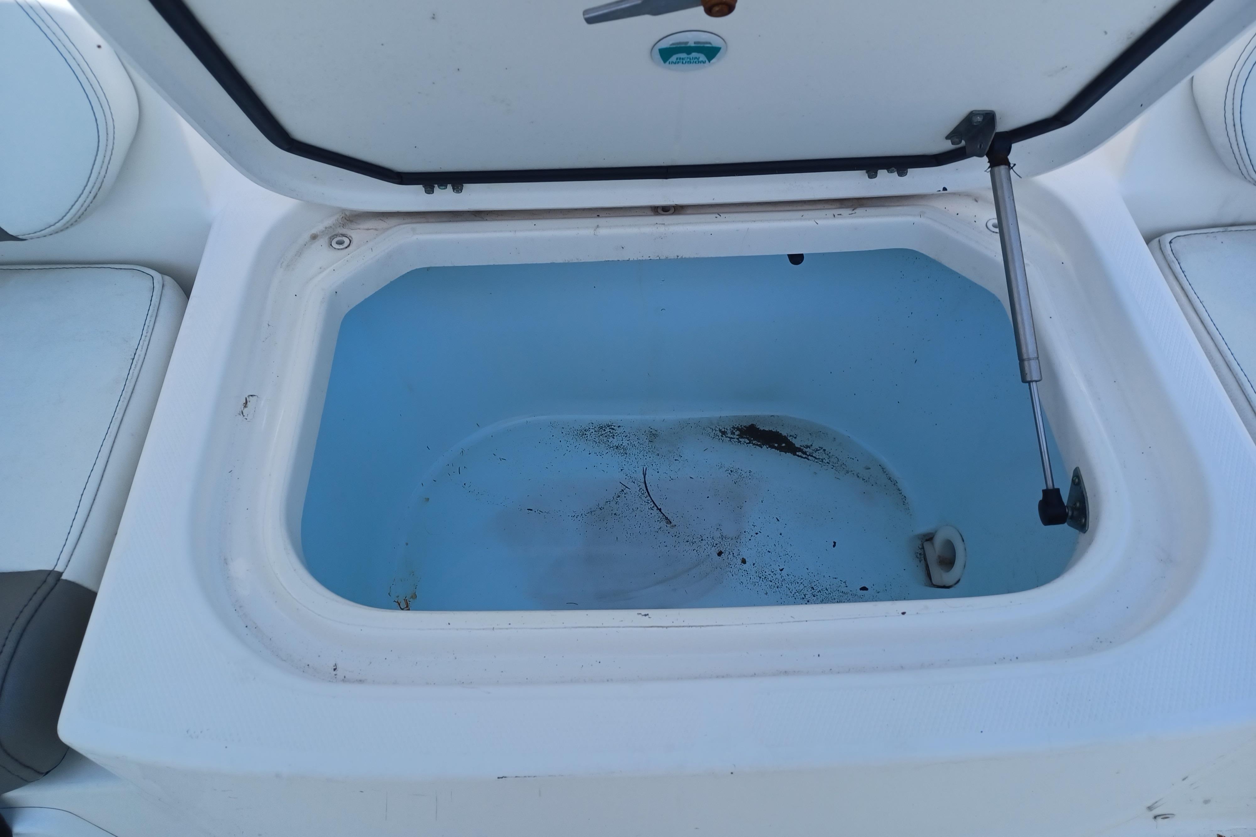 Open storage compartment on a 2020 World Cat 230 DC boat.