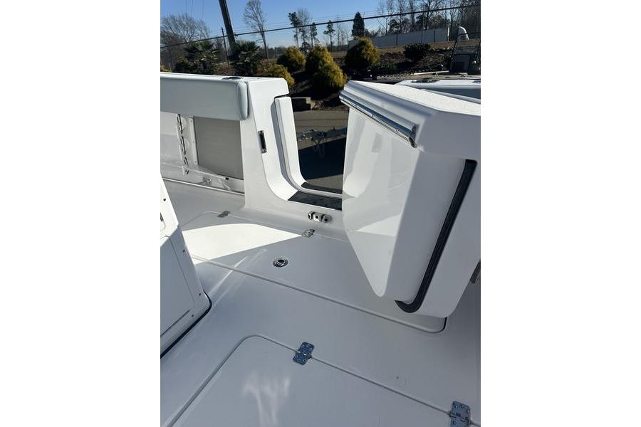 2026 Sportsman Open 282 Center Console boat interior with open storage compartment.