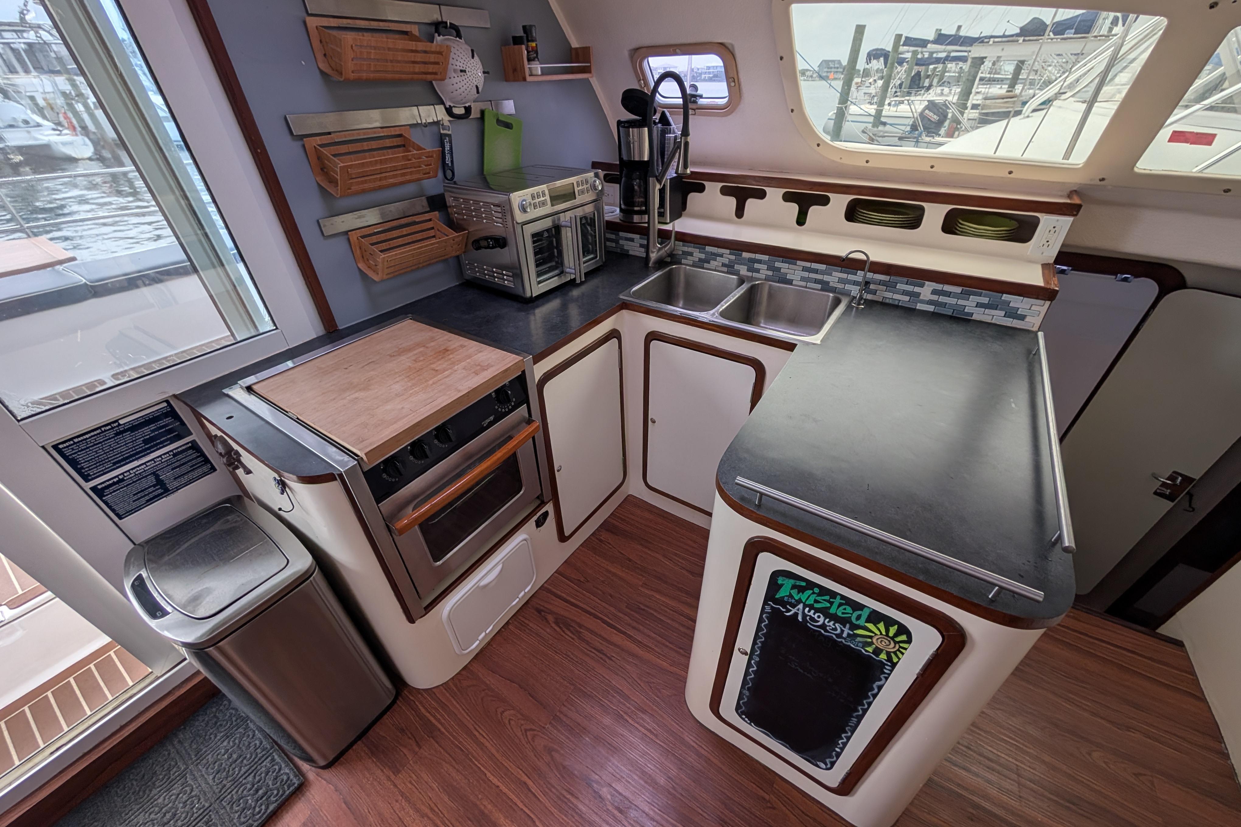 Kitchen area of a 1999 Island Spirit 37 yacht with modern appliances.