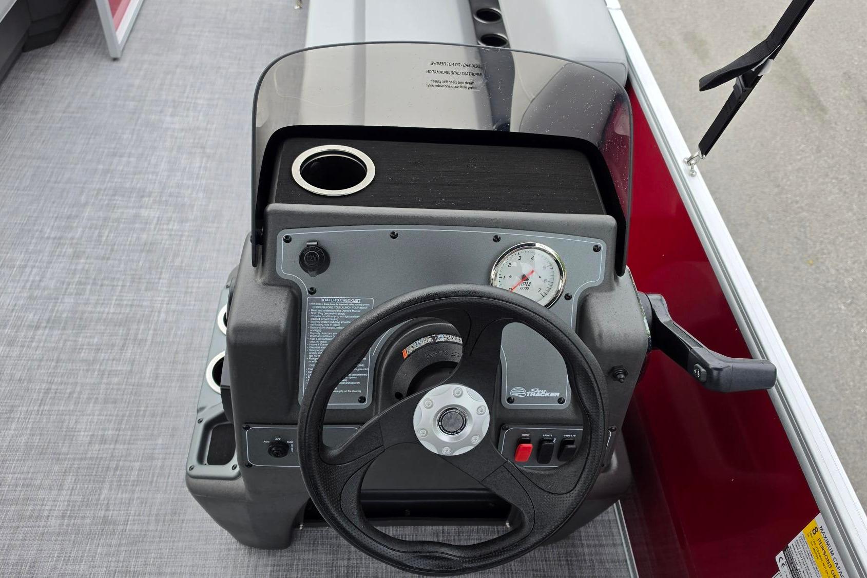 Steering console of 2026 Sun Tracker Party Barge 16 DLX pontoon boat.