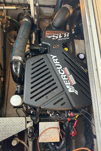 Mercury engine in a 2004 Sea Ray 380 Sundancer boat, showcasing detailed components.
