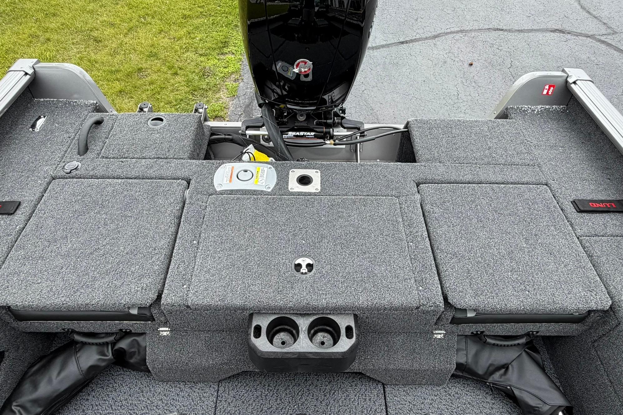 2027 Lund 1875 Impact XS Sport boat interior with motor and storage compartments.