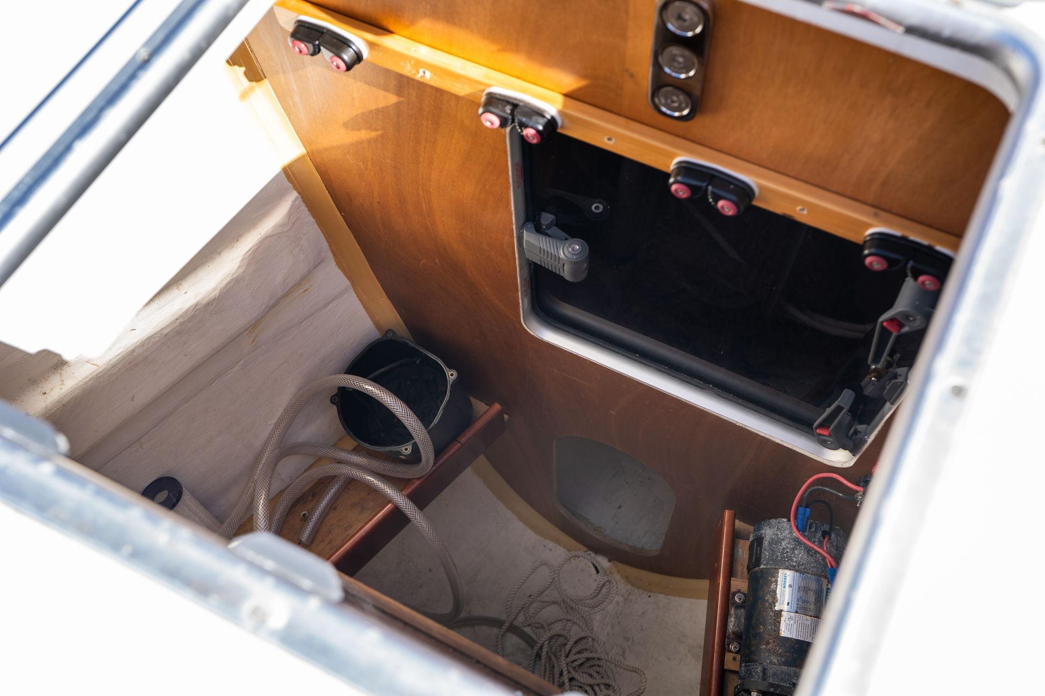 Interior view of 2013 Beneteau Oceanis 50 sailboat compartment with ropes and equipment.