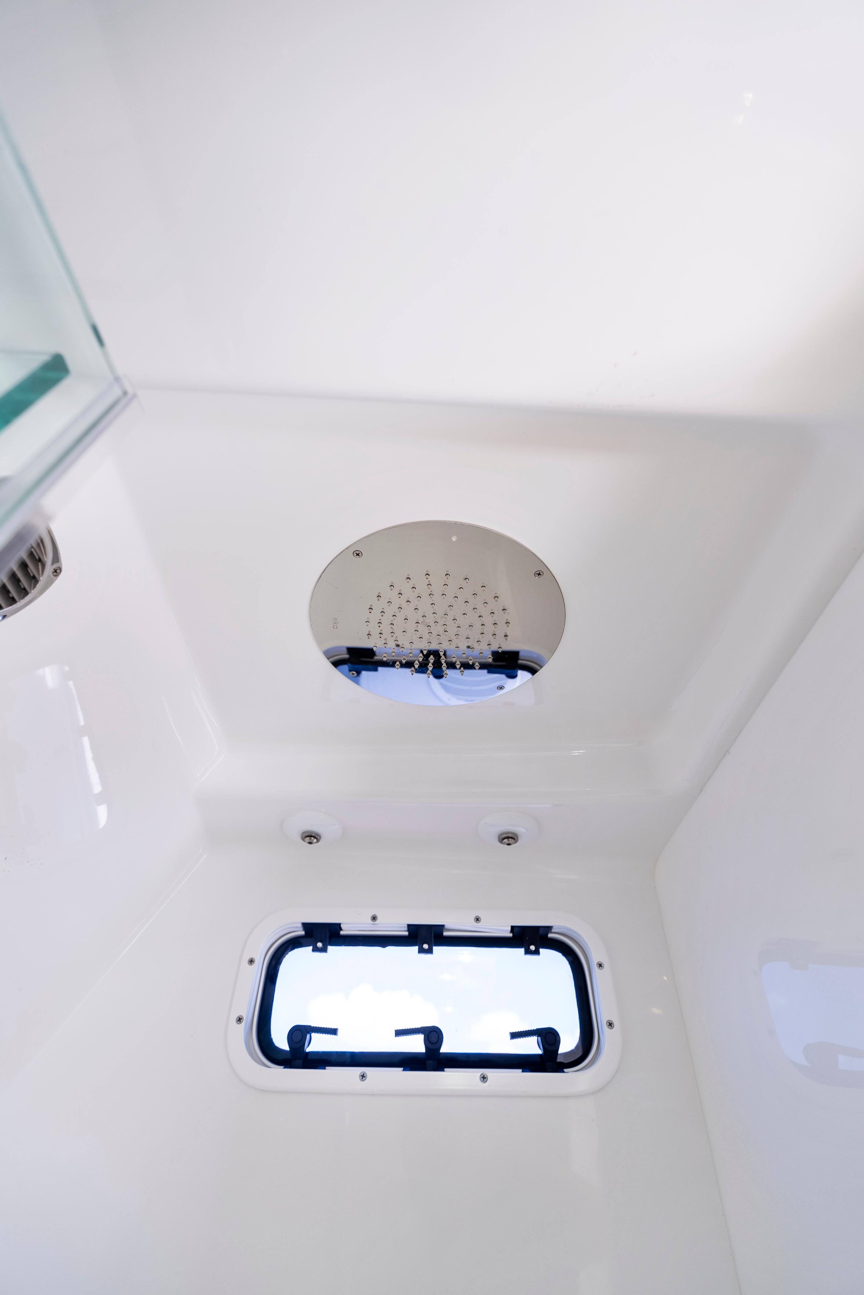 2022 HCB Suenos boat interior shower with window and modern fixtures.