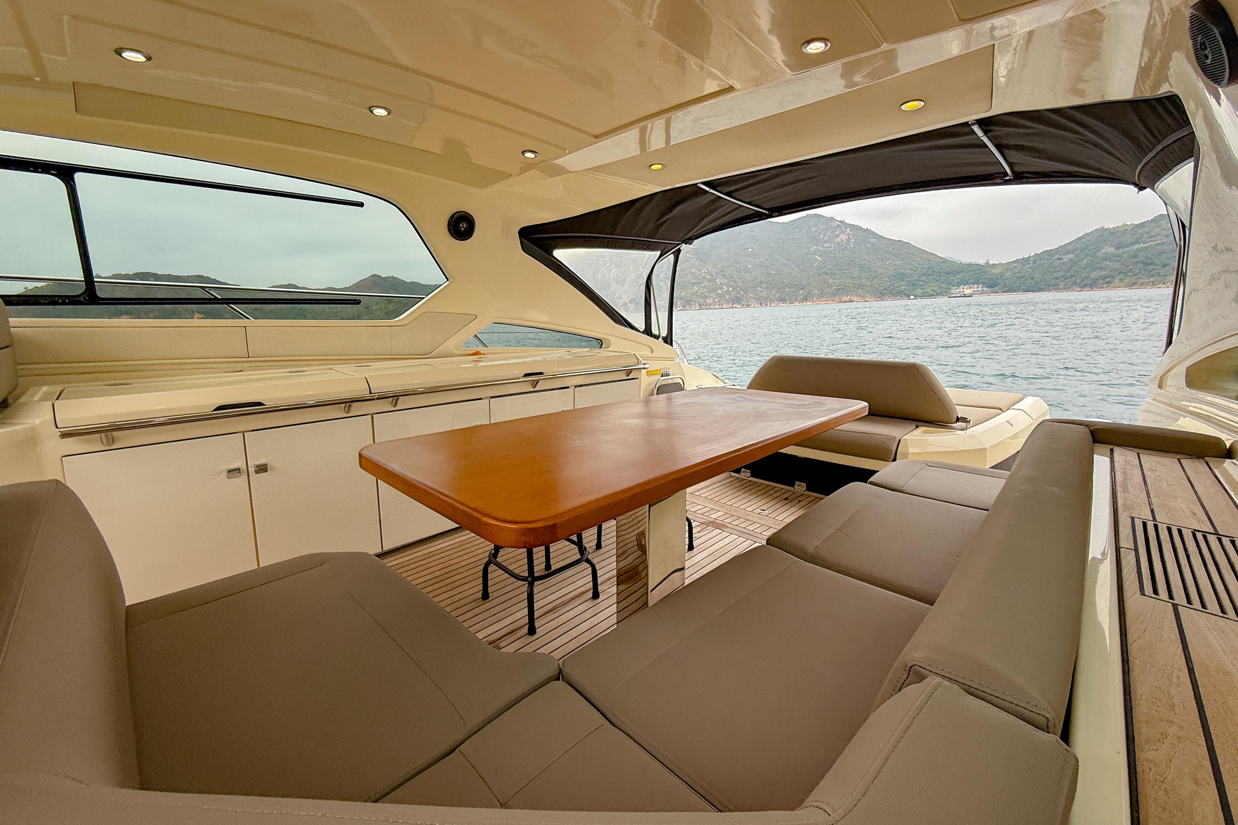 Luxurious 2012 Azimut Atlantis 58 yacht interior with spacious seating and scenic ocean view.