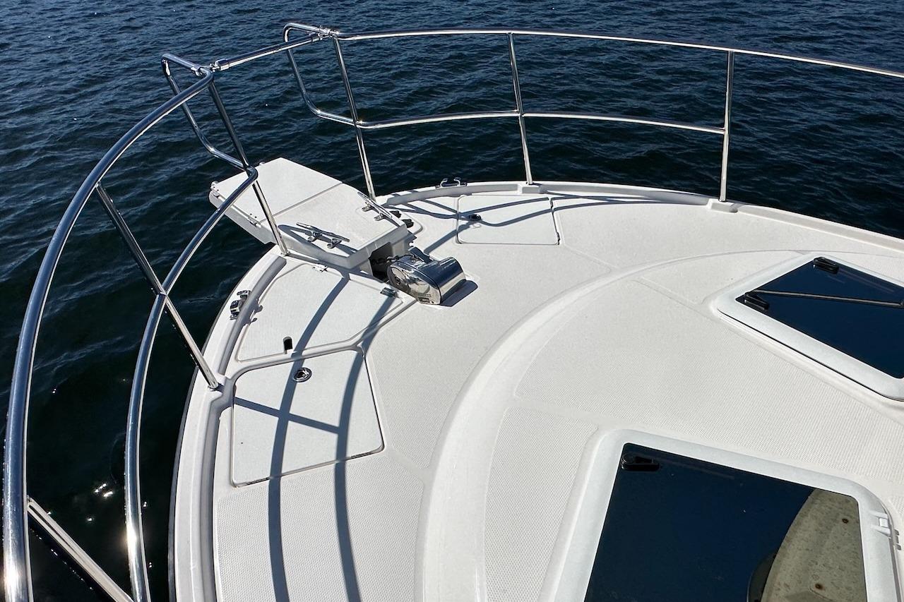 Bow of 2018 Ranger Tugs R-29 CB boat with stainless steel railings.