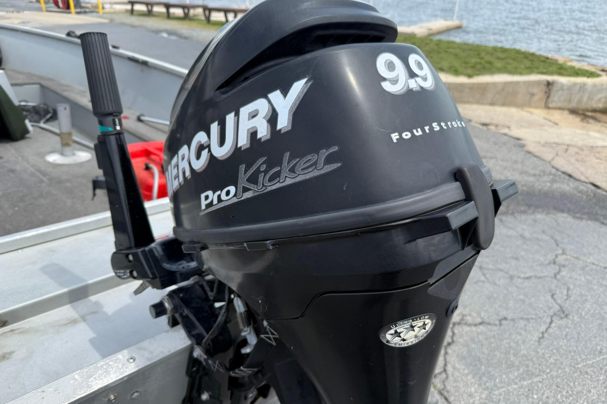Mercury ProKicker 9.9 FourStroke outboard motor on 2013 Alumacraft Fisherman 160 Tiller boat.