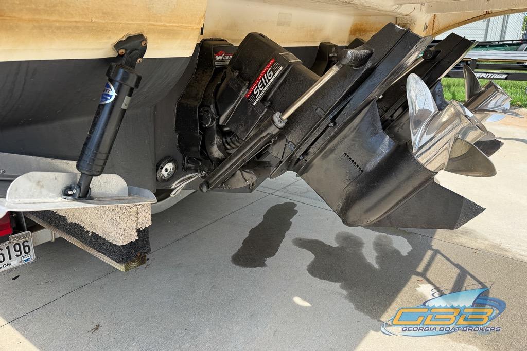 1999 Sea Ray 290 Sundancer boat stern drive and propellers, displayed on a trailer.
