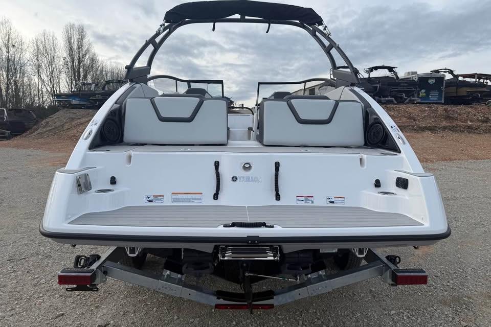 2026 Yamaha Boats AR250 rear view on trailer, showcasing sleek design and seating.