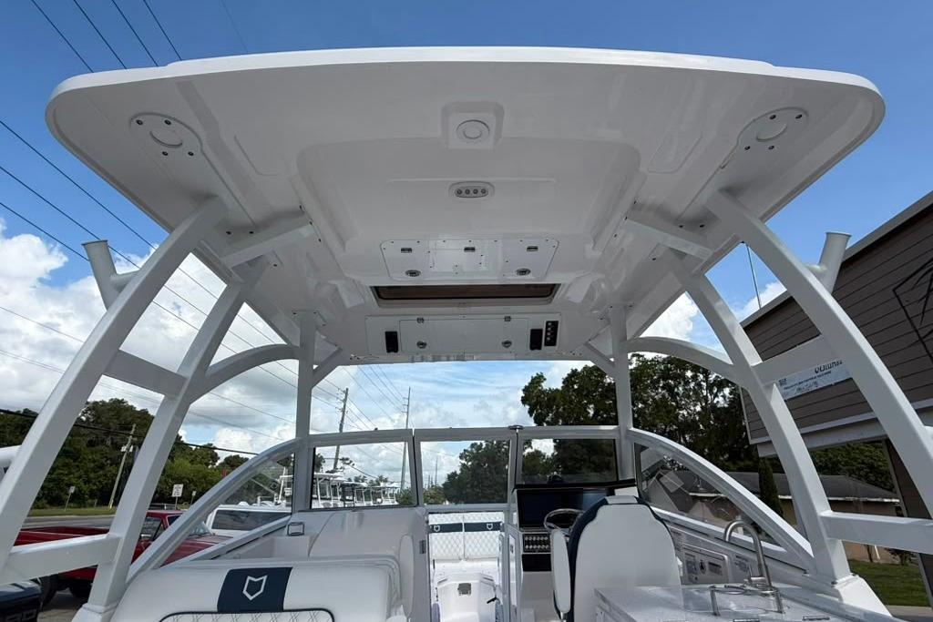 2026 Sea Fox 288 Traveler boat interior with modern helm and overhead structure.