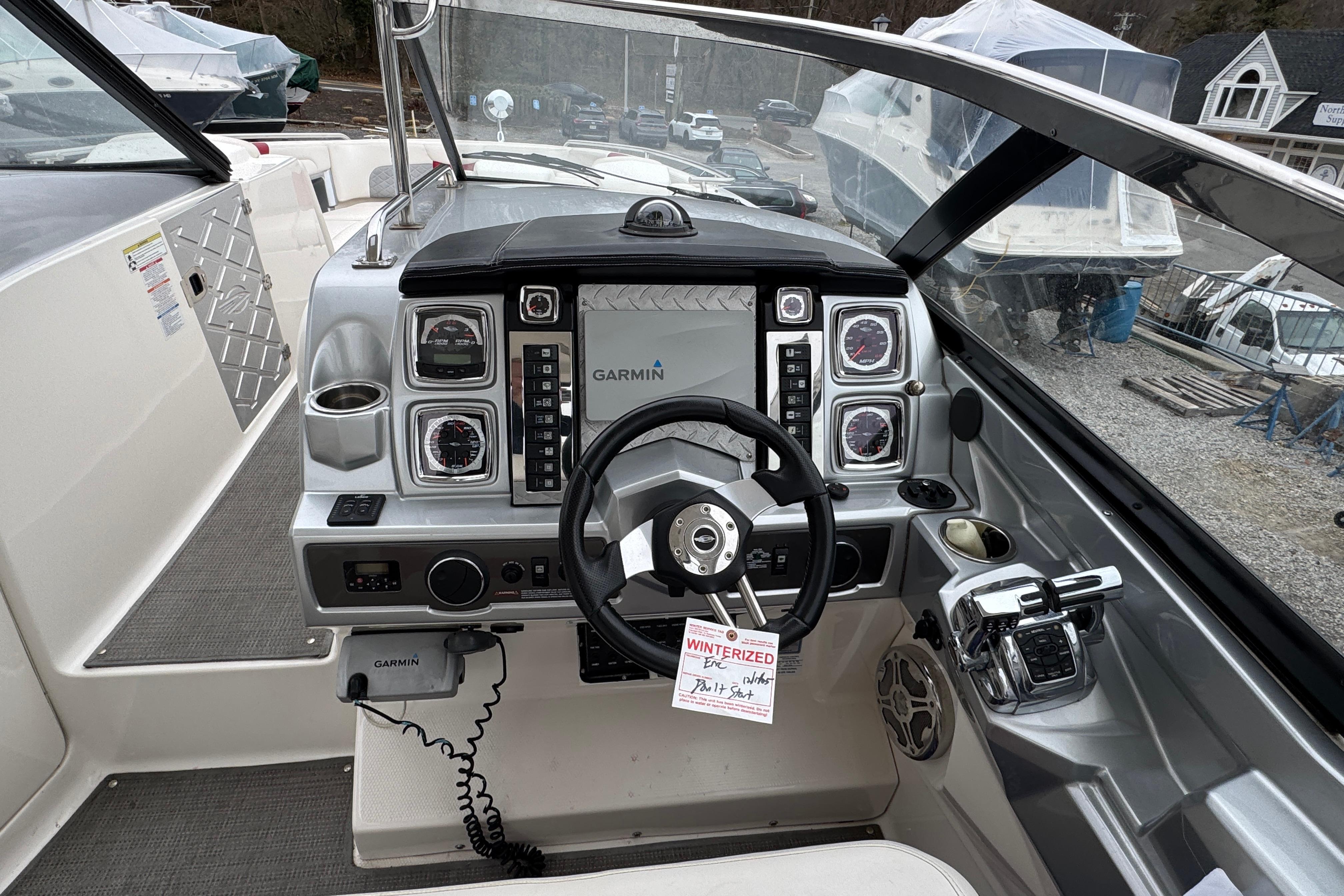 2012 Chaparral 327 SSX boat dashboard with Garmin navigation system and controls.