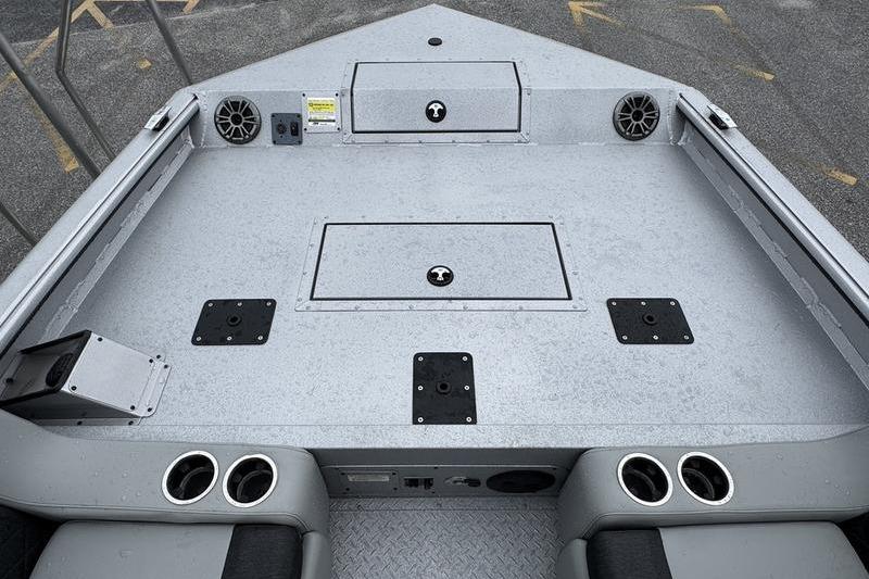 2025 SeaArk Super Lounge Easy boat deck with storage compartments and cup holders.