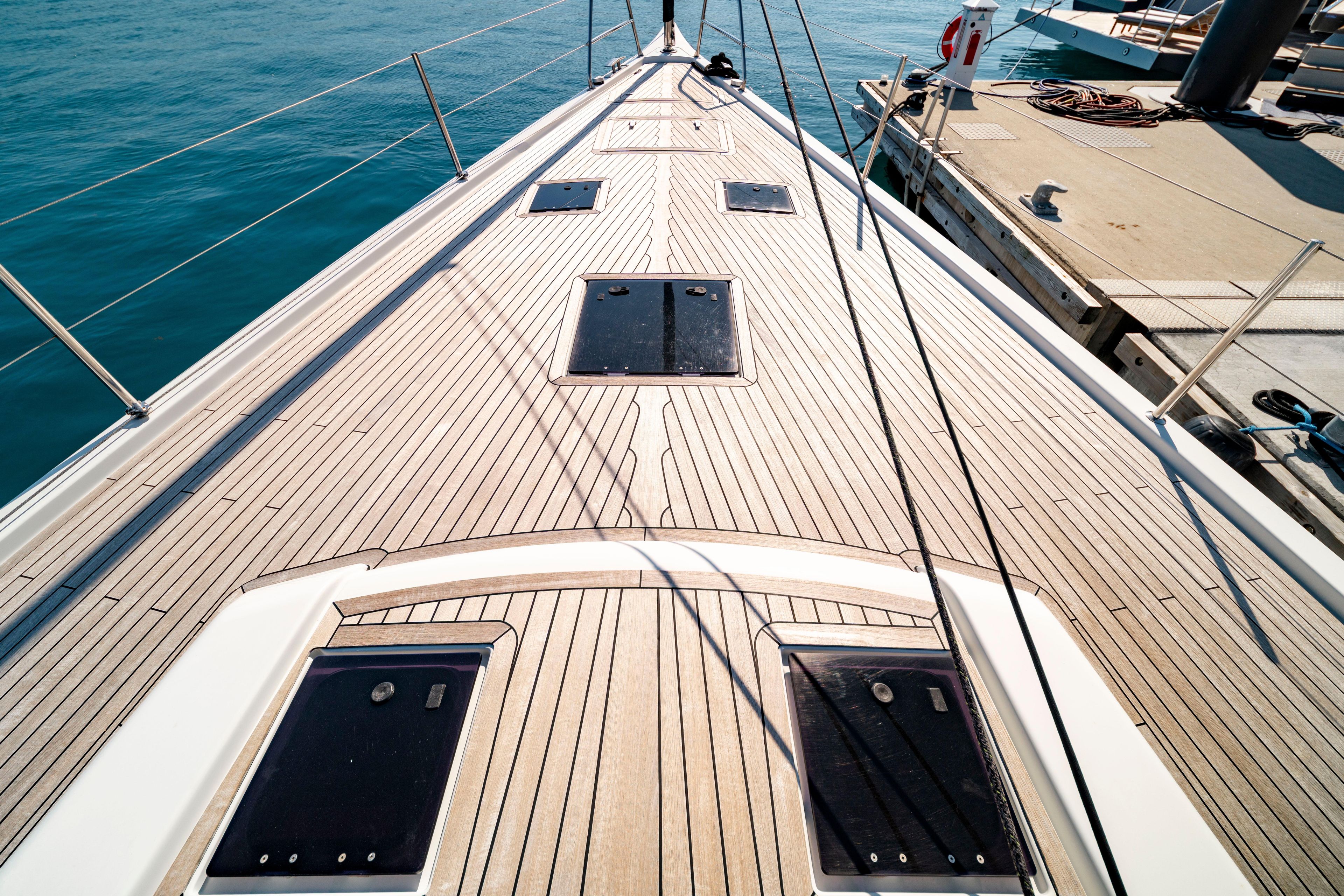 Grand Soleil 58 yacht deck, 2016 model, docked at marina with clear blue water.