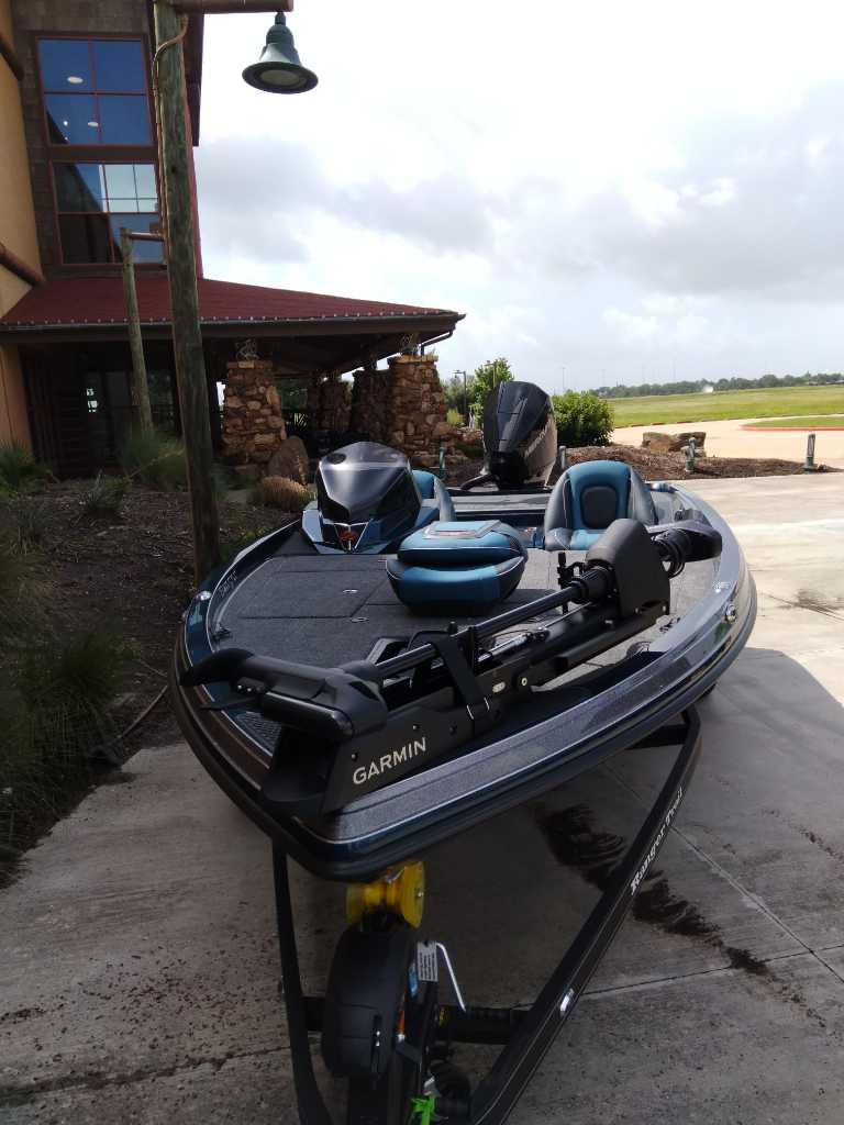 2025 Ranger Z518 boat with Garmin equipment parked outside a rustic building.