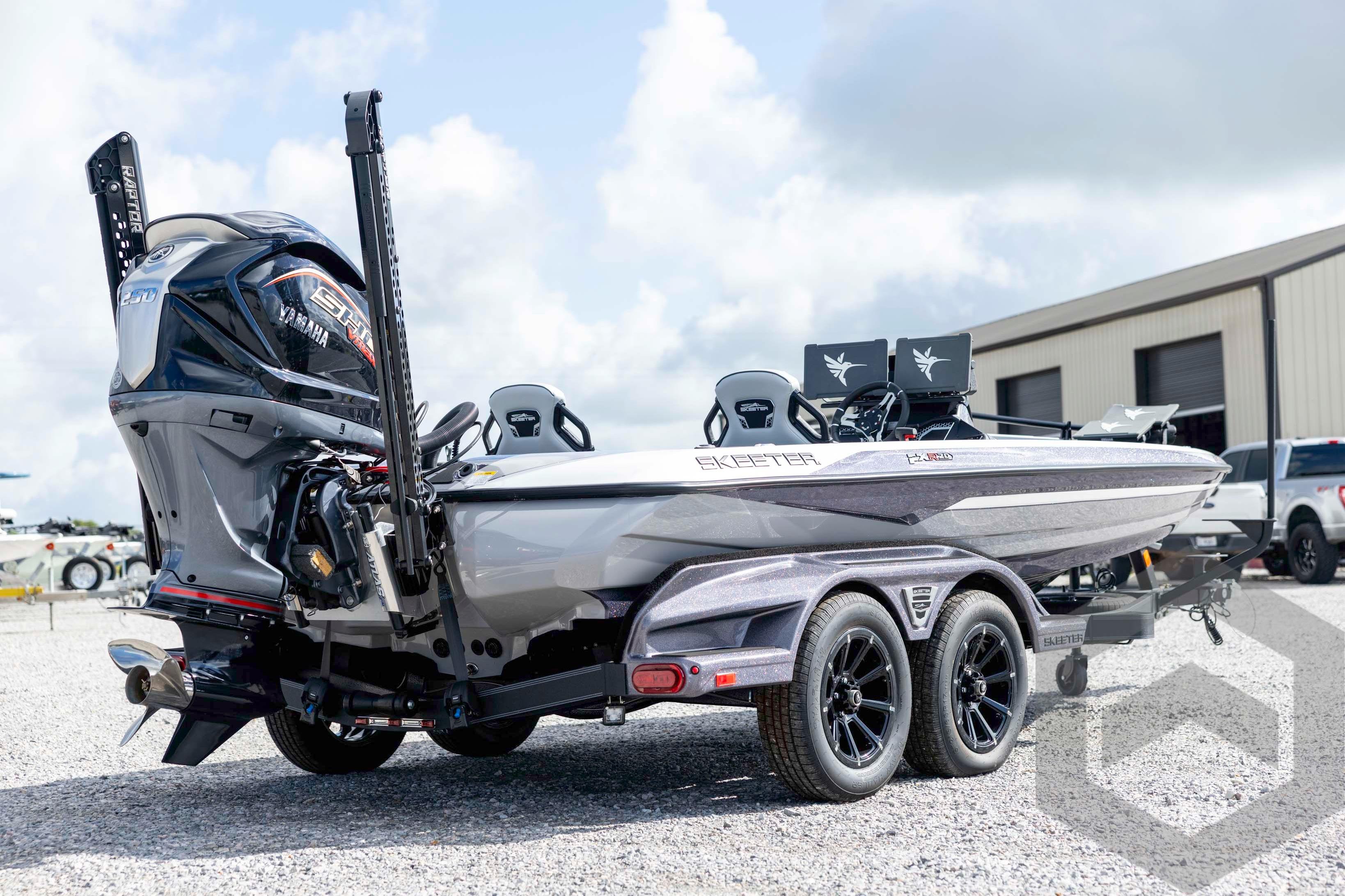 2026 Skeeter FXR20 FLEX boat with Yamaha engine on a trailer, parked outdoors.