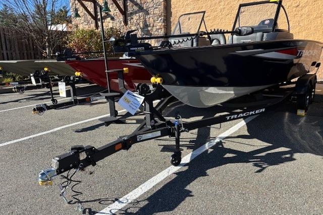 2025 Tracker Targa V-18 Combo boat on trailer in parking lot.