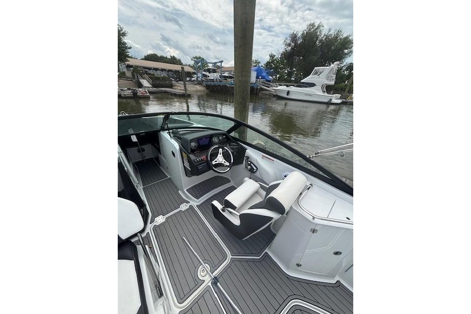 2023 Monterey M-45 boat interior with sleek design, docked near other boats.
