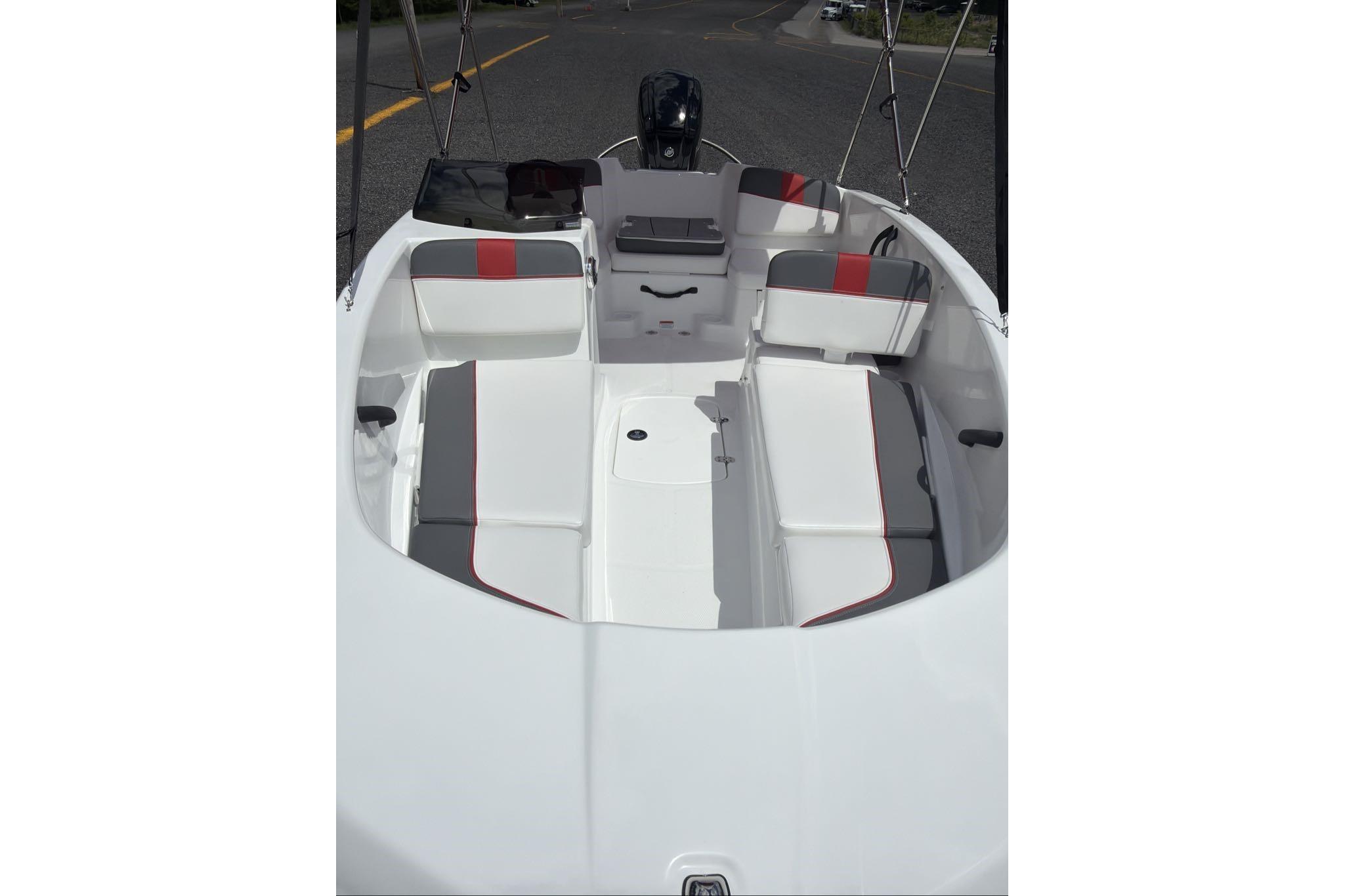 2026 Tahoe T16 boat interior with white and gray seating, red accents.