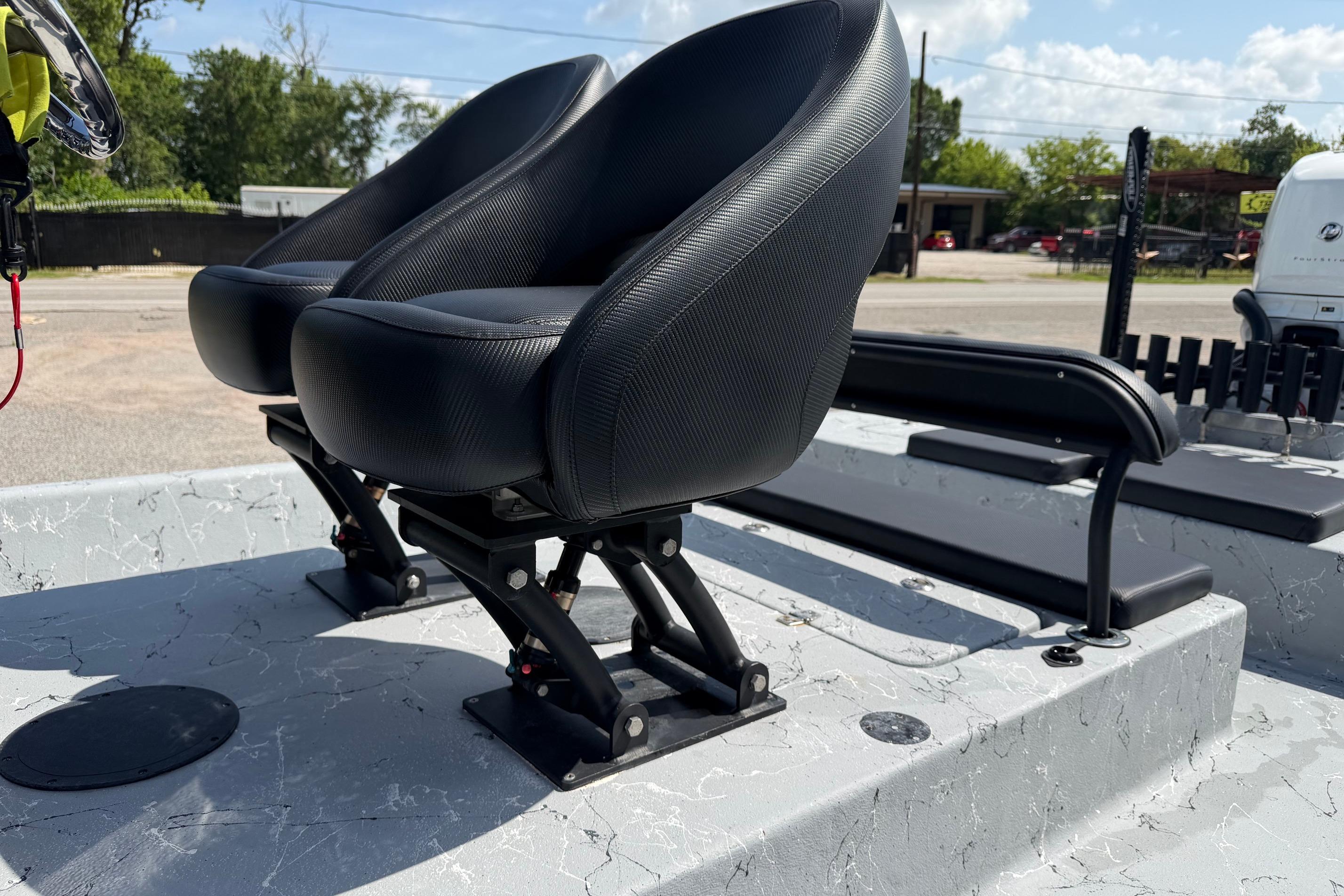 2023 Haynie 23 Super Cat boat seats, featuring sleek black design and sturdy construction.