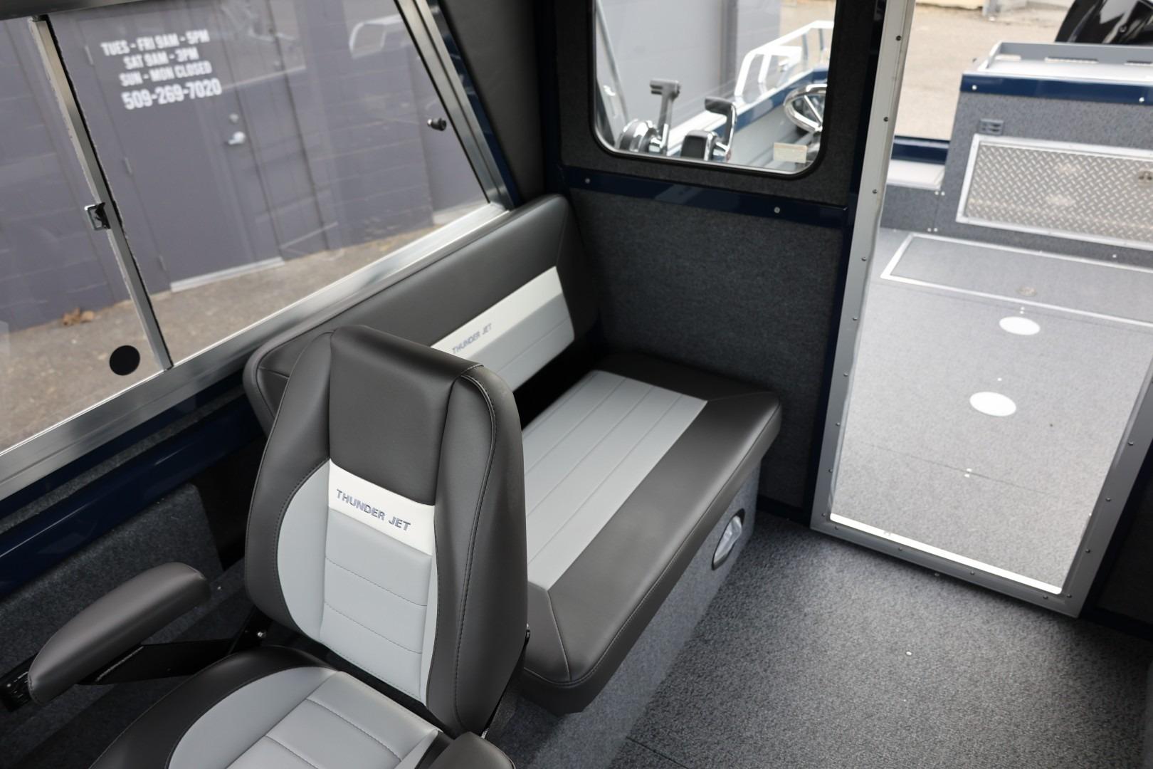 Interior of 2026 Thunder Jet 24 Alexis Pro boat, featuring seating and modern design.