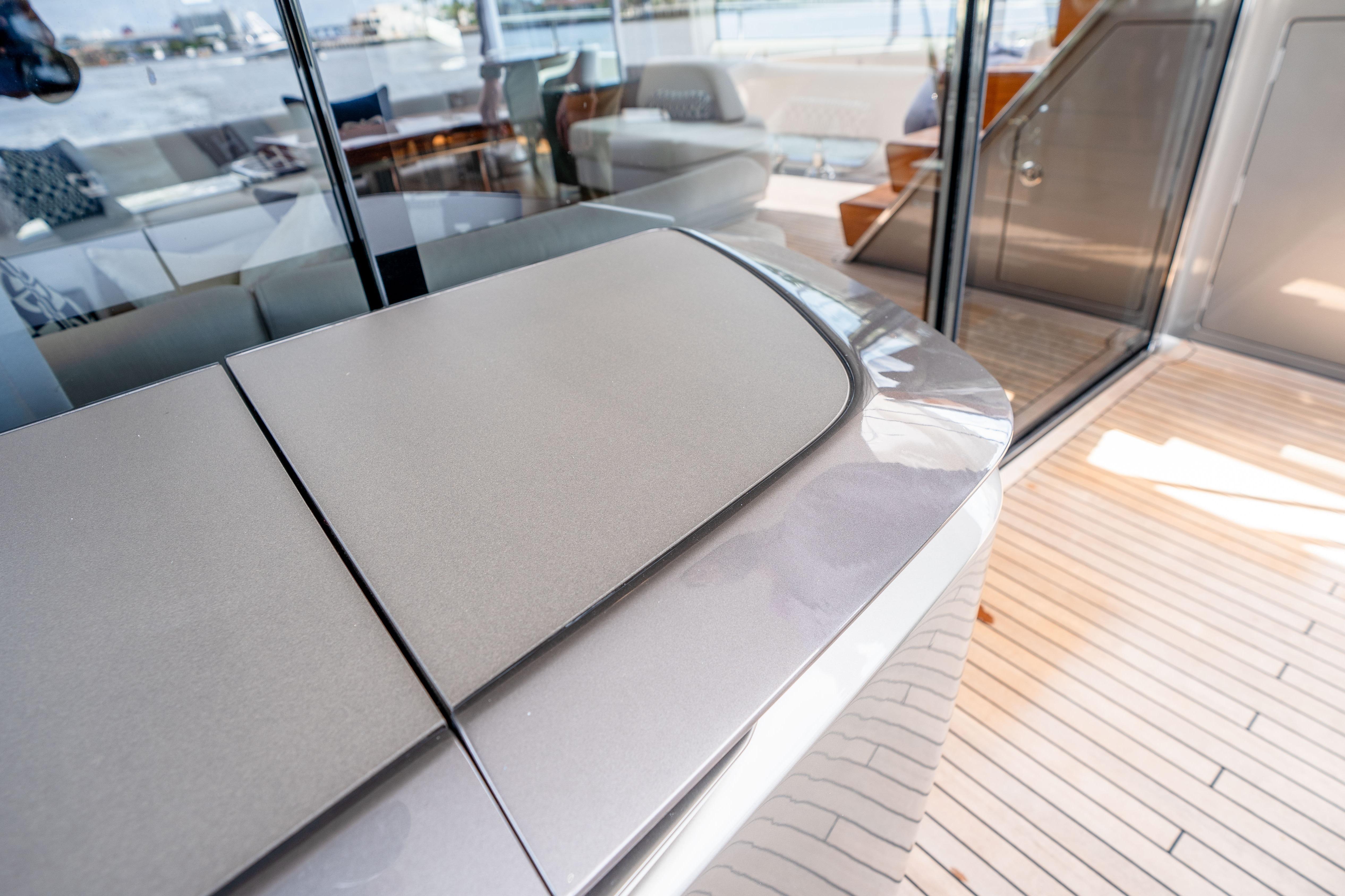 Luxurious interior of 2020 Princess Y85 yacht with sleek design and wooden flooring.