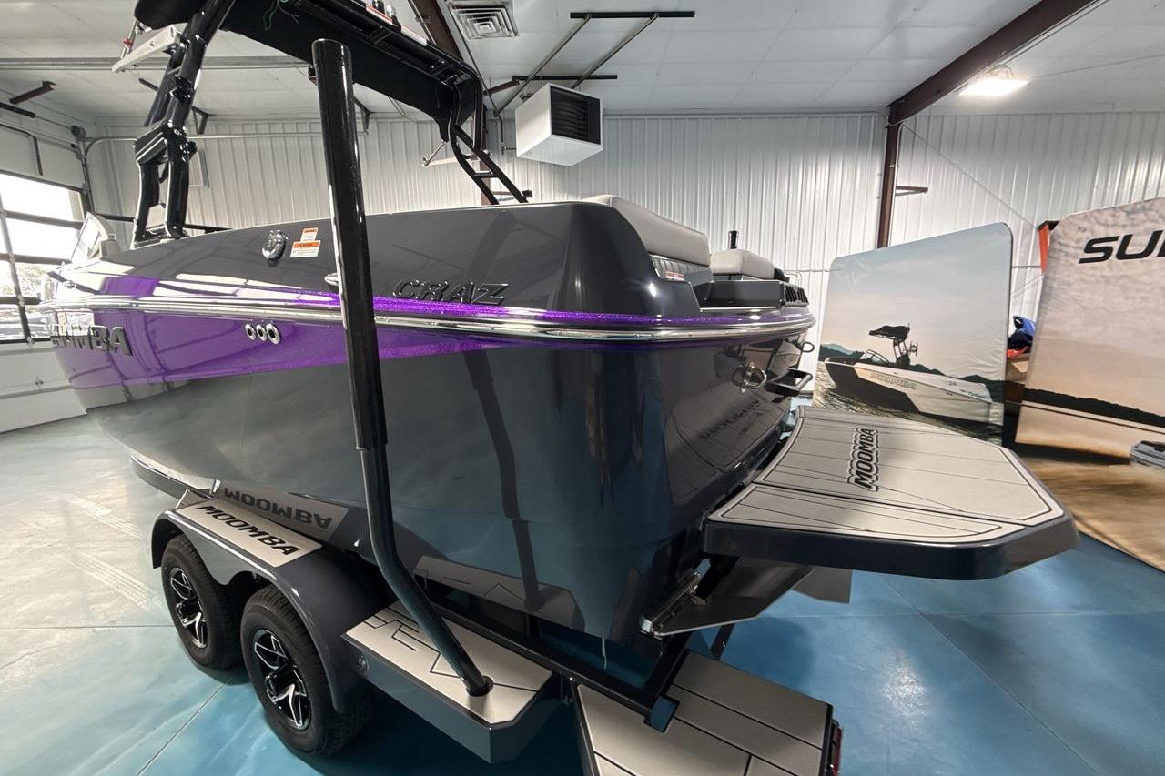 A 2026 Moomba Craz boat on a trailer inside a showroom.