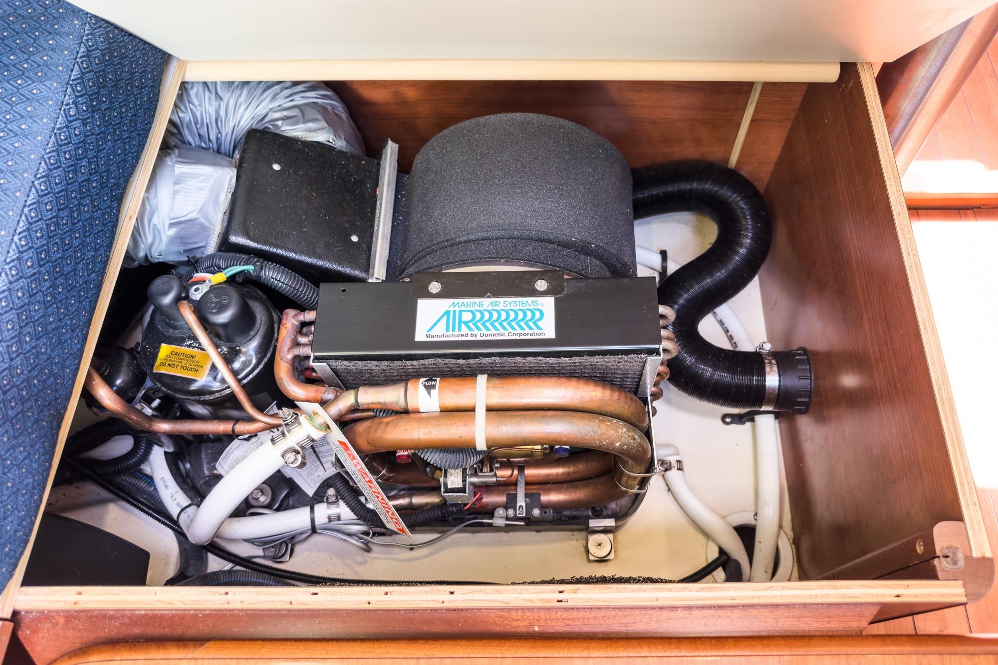 Engine compartment of a 2015 Hunter 33 sailboat, featuring marine air systems.