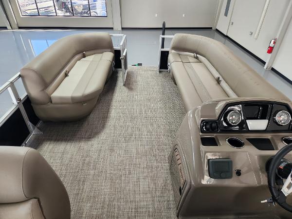 Interior of 2025 Ranger 200C pontoon boat with beige seating and modern dashboard.