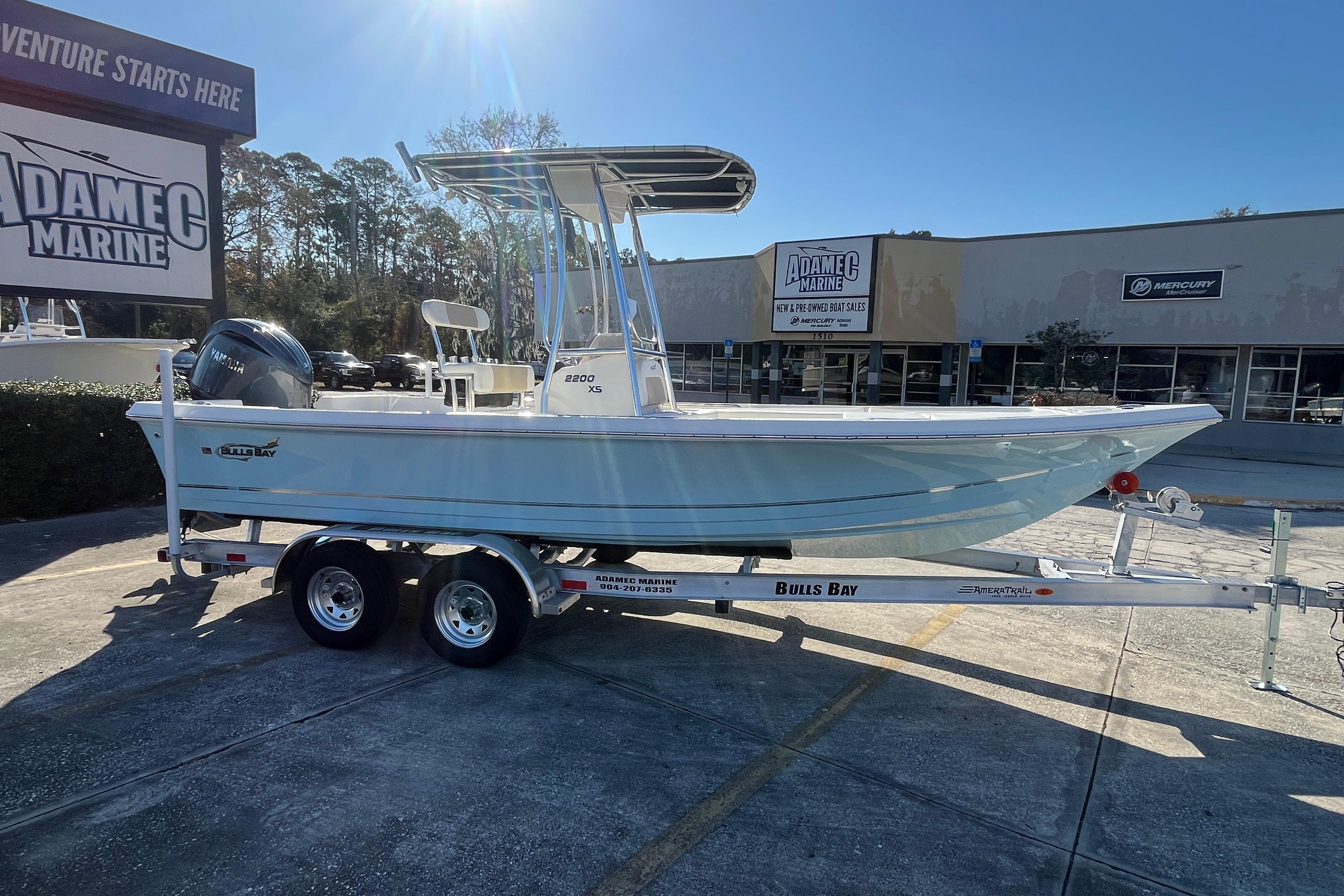 2026 Bulls Bay 2200 boat on trailer at Adamec Marine dealership.