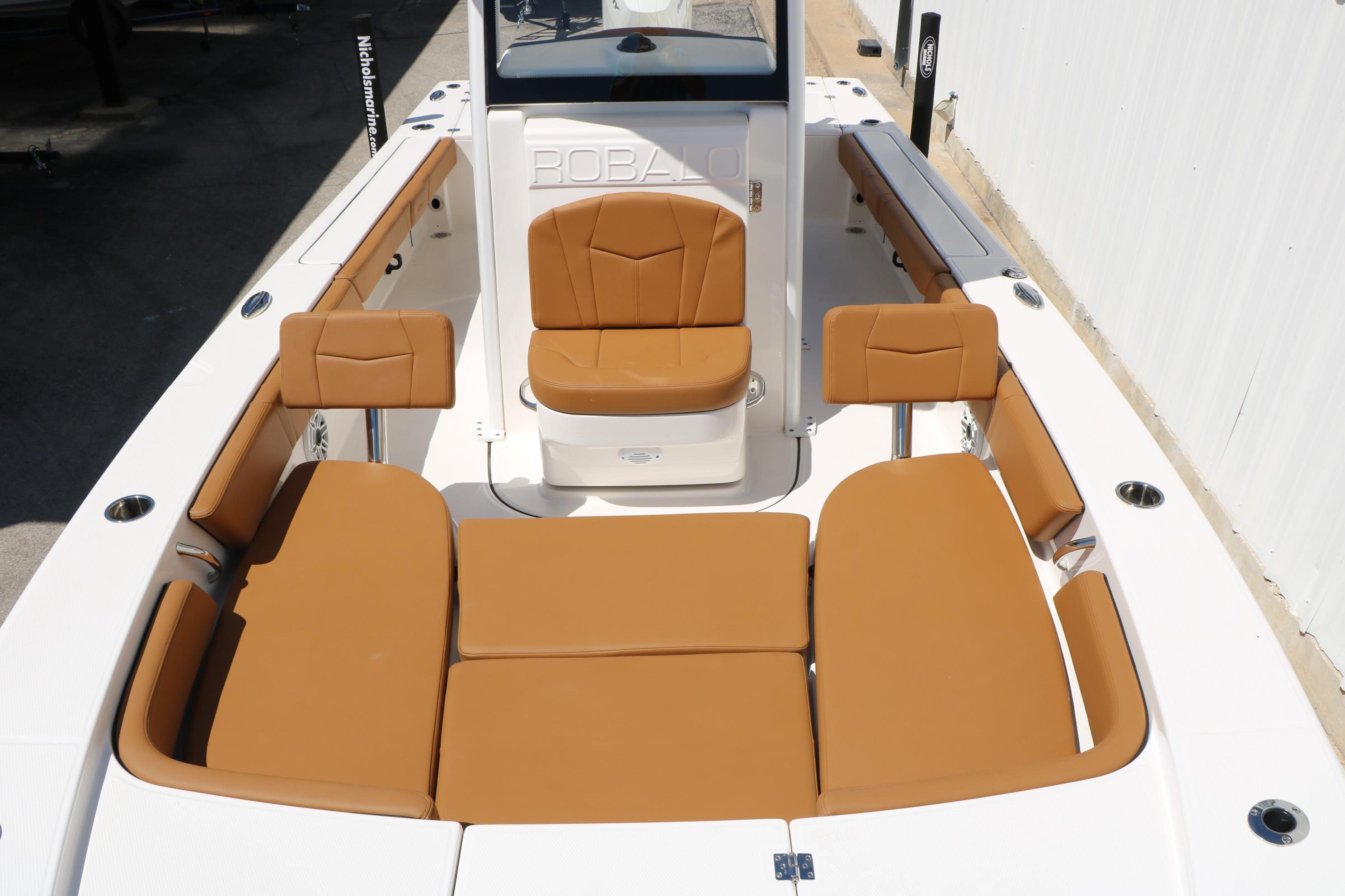 2026 Robalo 246 Cayman boat interior with tan seating and spacious layout.