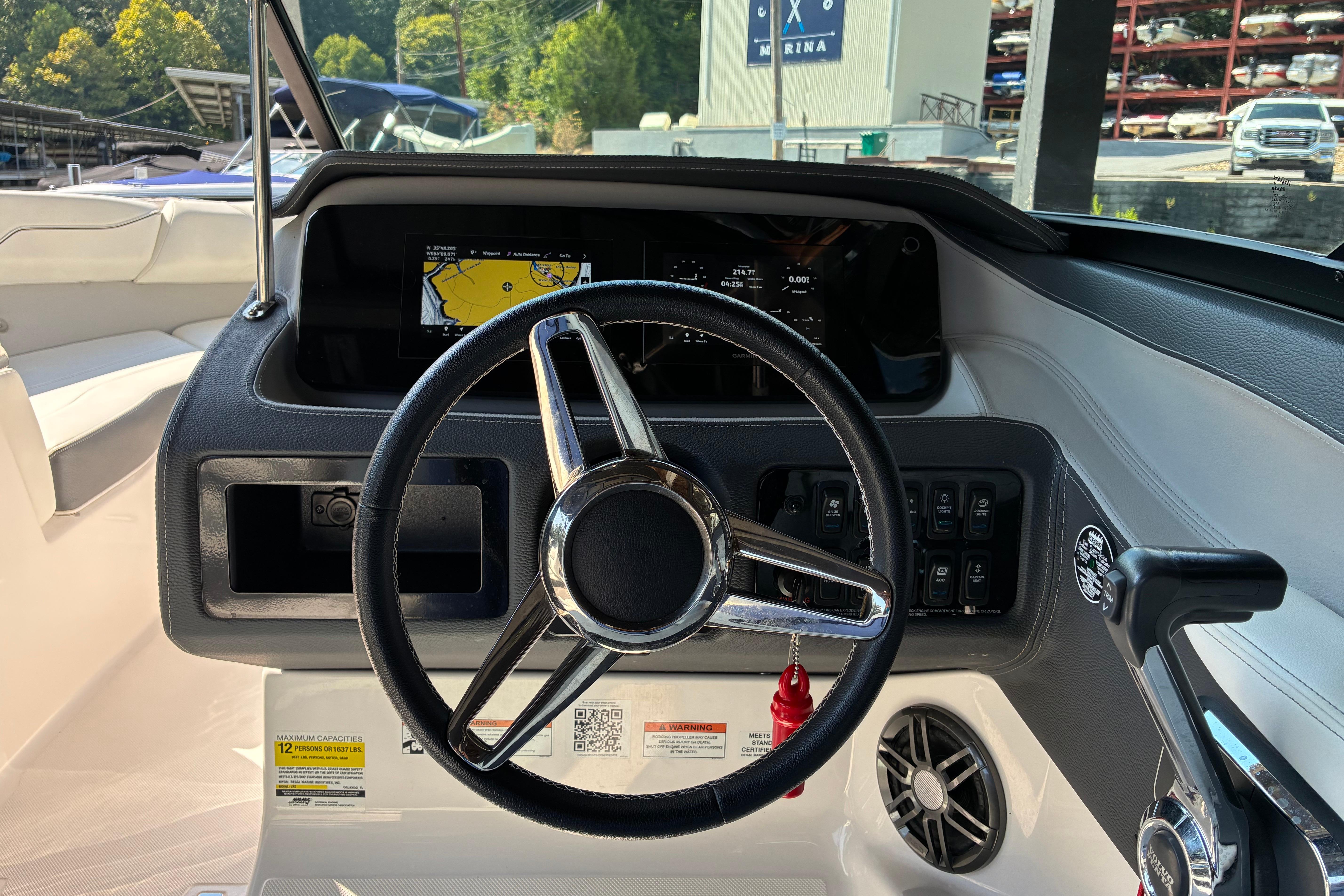 2025 Regal LS2 boat dashboard with steering wheel and navigation display.