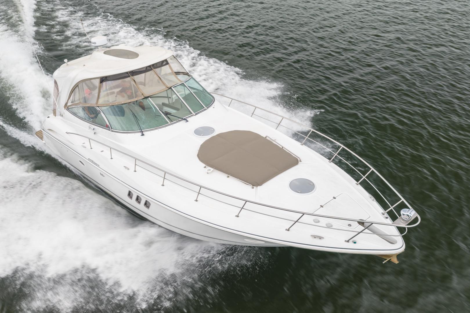 2008 Cruisers Yachts 460 Express cruising on open water, showcasing sleek design and performance.