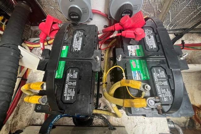 2004 Cruisers Yachts 3372 Express engine compartment with dual marine batteries.