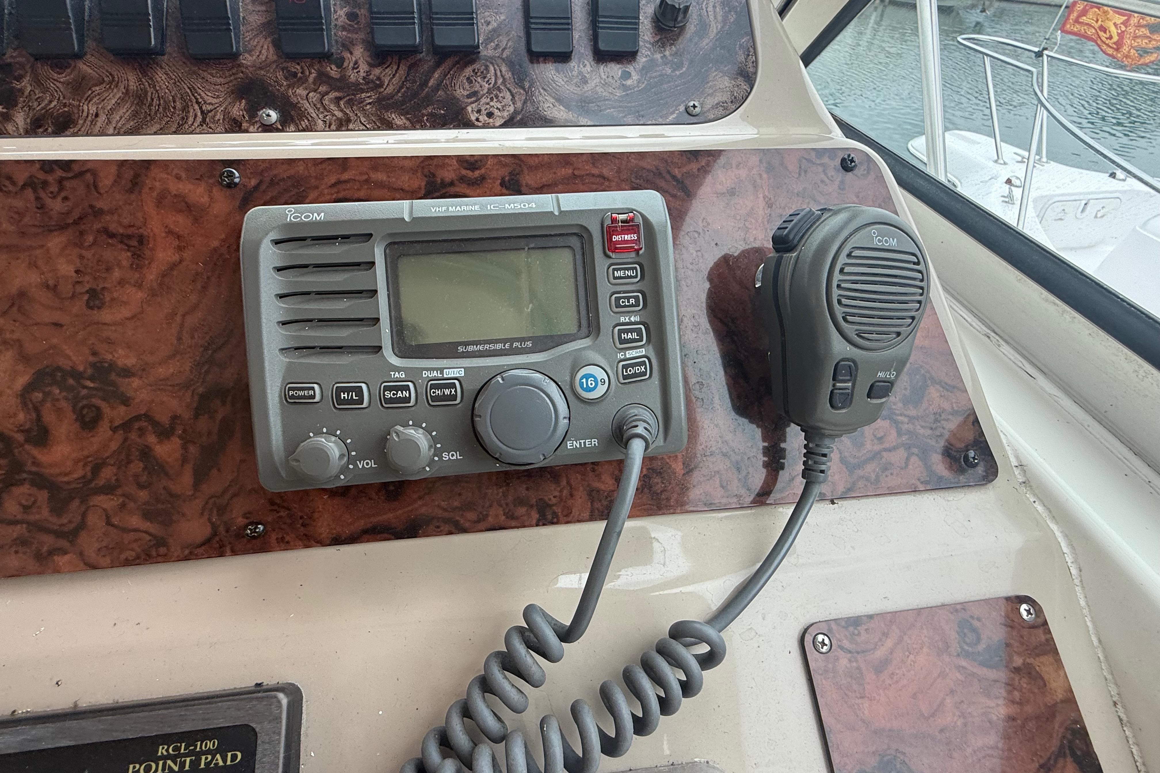 VHF marine radio on 1998 Sea Ray Sundancer 400 boat dashboard.