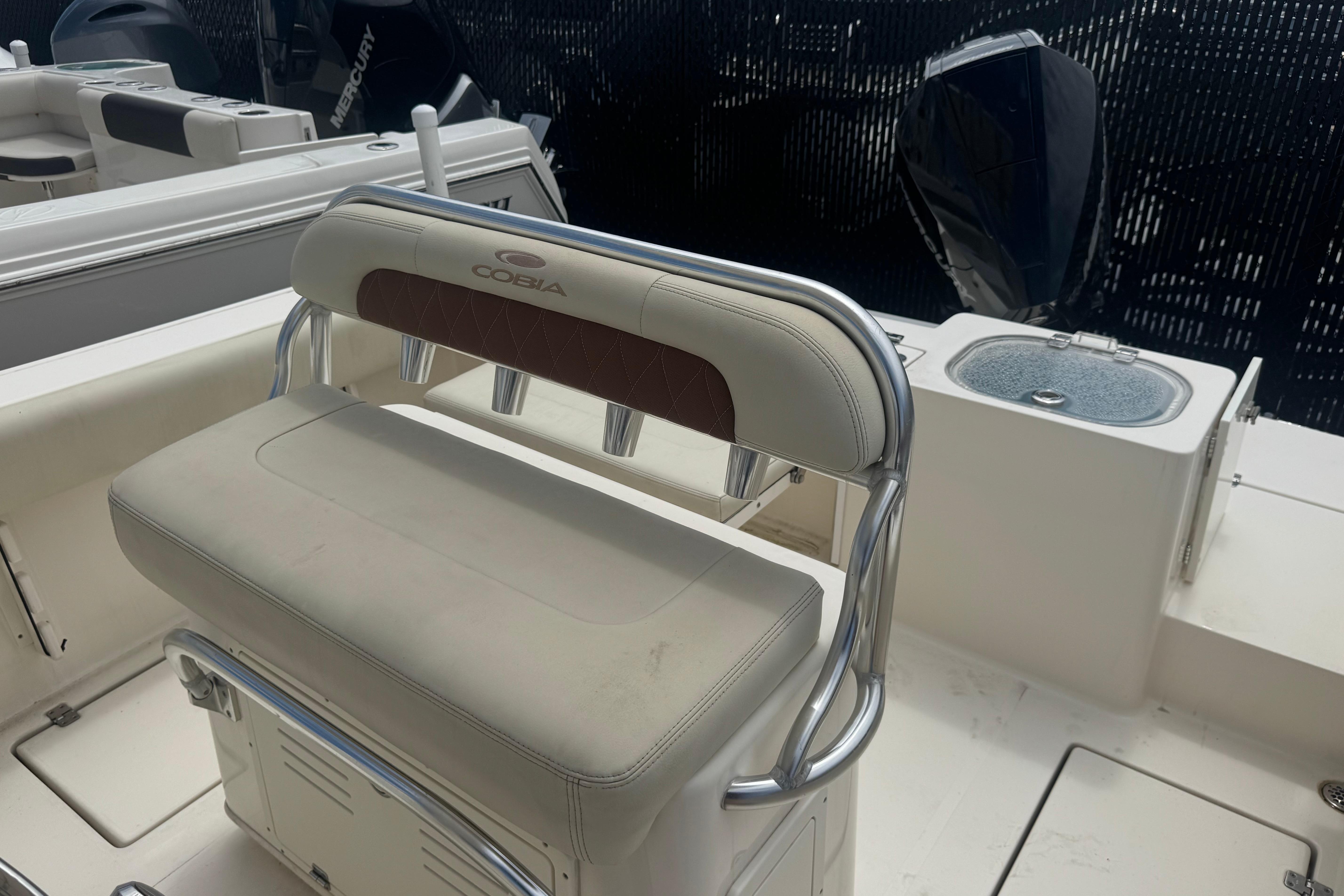 2022 Cobia 237 Center Console boat interior with seating and rod holders.