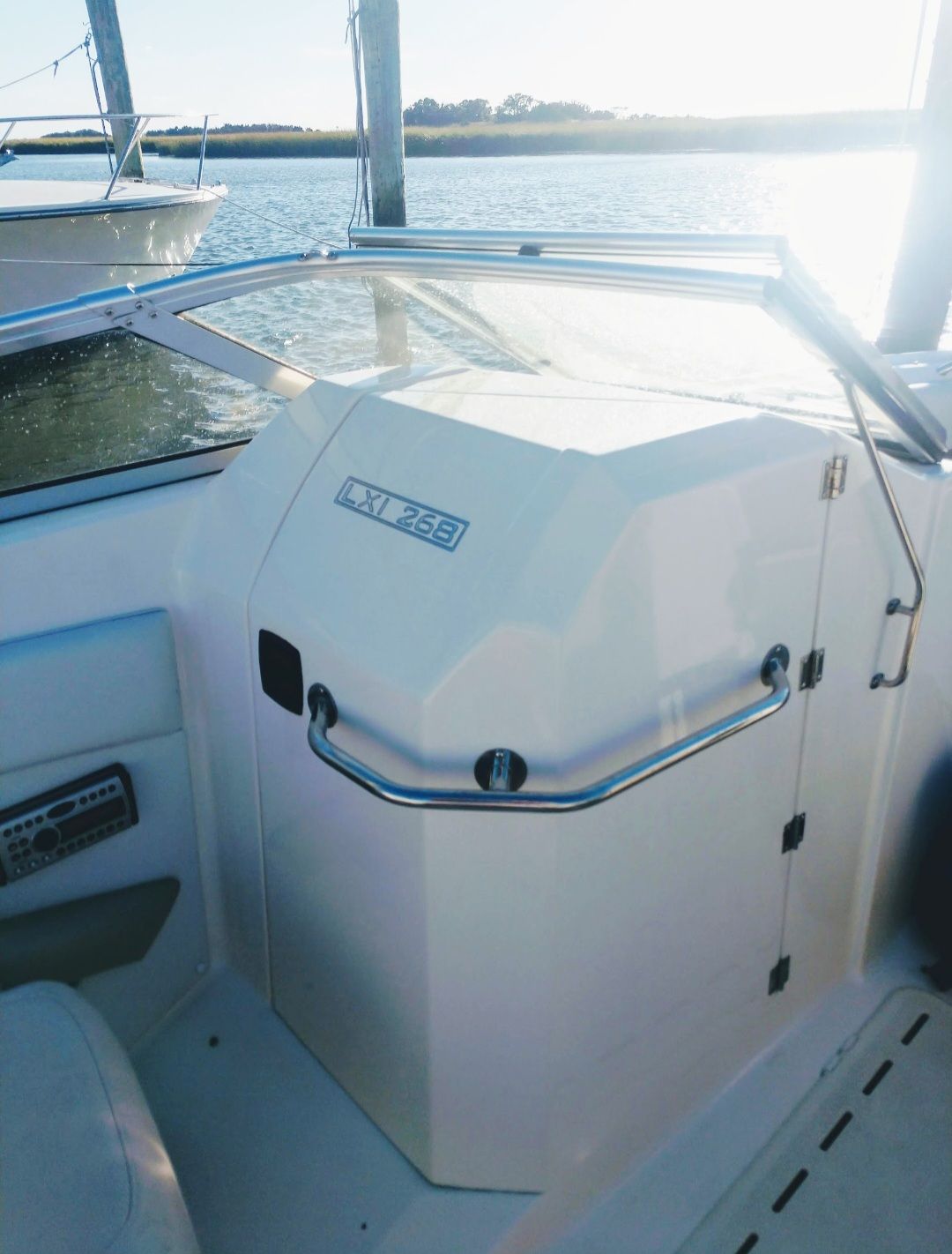 2007 Larsen LXi 268 boat on calm water.