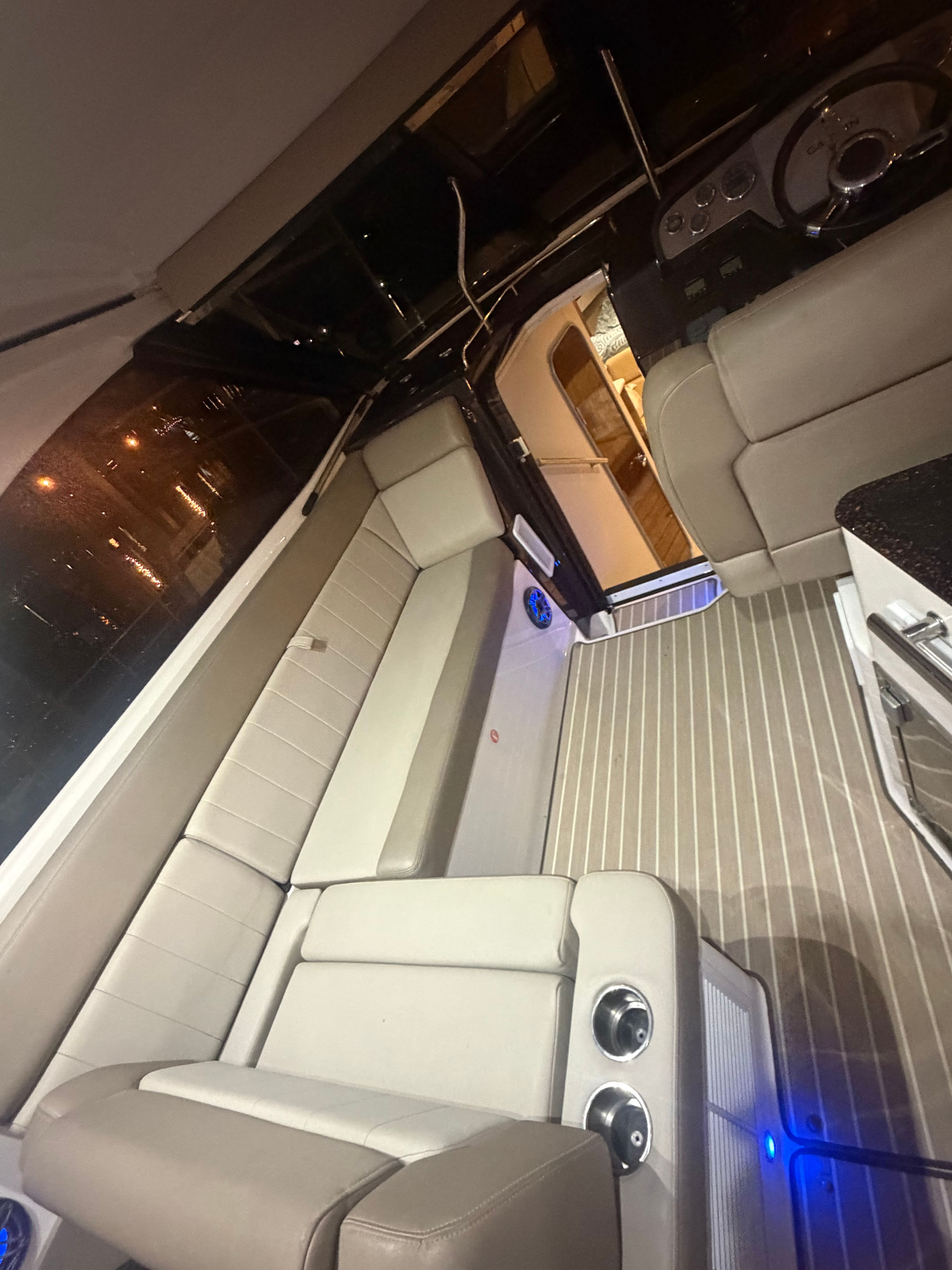 Interior of a 2015 Regal 35 Sport Coupe yacht at night.